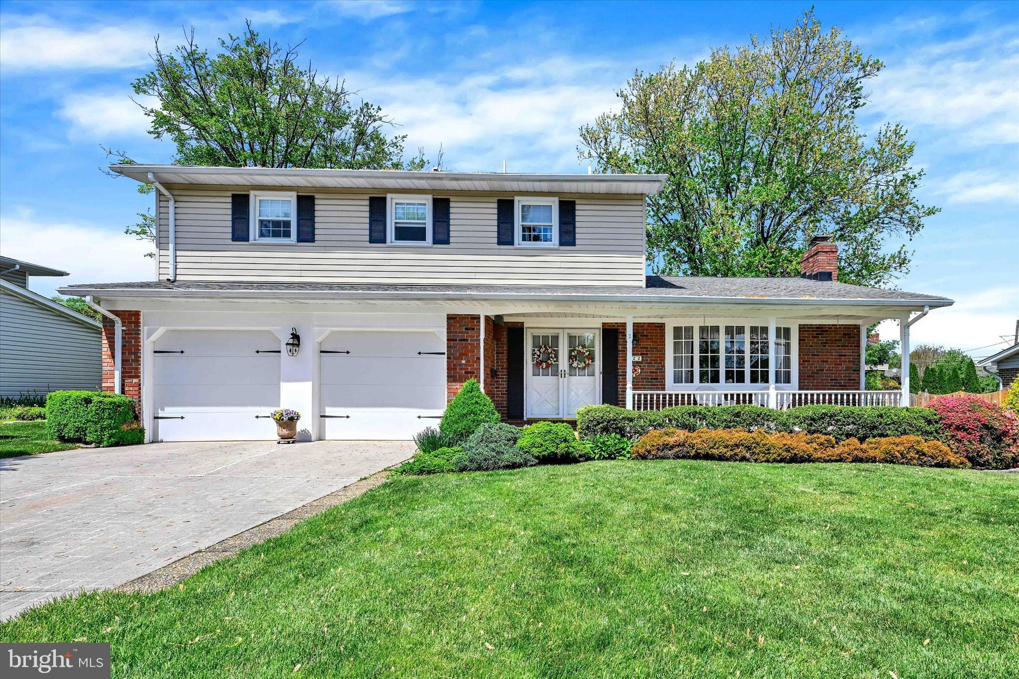 Quality Built, Warm & Inviting Four Bedroom Colonial. Great Curb Appeal, too! Step Onto the Covered Front Porch and Enter the Foyer to Start Your Tour of this Lovely Home. First Stop, a Beautiful Living Room with Wood Burning Fireplace, Adorned with Crown Molding, Bay Window & Hardwood Flooring, Which is Open to the Formal Dining Room, Also with Hardwood Flooring, Crown Molding & Chair Rail as Well. The Updated Kitchen Includes a Pantry, French-Style Refrigerator, Dishwasher, Stove Top, Wall Oven, Microwave & Granite Counters. Just Off the Kitchen is the Breakfast Area & Cozy Family Room with a Wood Burning Fireplace, Brick & Panel Walls and Wood Peg Hardwood Flooring Perfect for Family Gatherings! The 25 x 16 Patio is Right Off of the Family Room for Outdoor Entertaining and Includes a Hot Tub and Water Fountain. There is Also a Powder Room on the Main Level. On the Upper Level You Will Find Four Spacious Bedrooms....All with Hardwood Flooring. The Primary Bedroom Boasts Great Closet Spaces, and a Hide-Away Hamper in the Well Appointed Primary Bath with Dual Sinks and Tiled Shower Stall. The Hall Bath on this Level has also Been Updated with Dual Sinks & a Tile Surround Tub. Even More Living Space on the Lower Level with a Large Recreation Room that Includes Updated LVP Flooring. There is Also Storage in the Lower Level with Built-in Shelving, Work Bench, Craft Bench, Washer/Dryer & Sanitary Tub. This Gorgeous Home Will Check All the Boxes!!