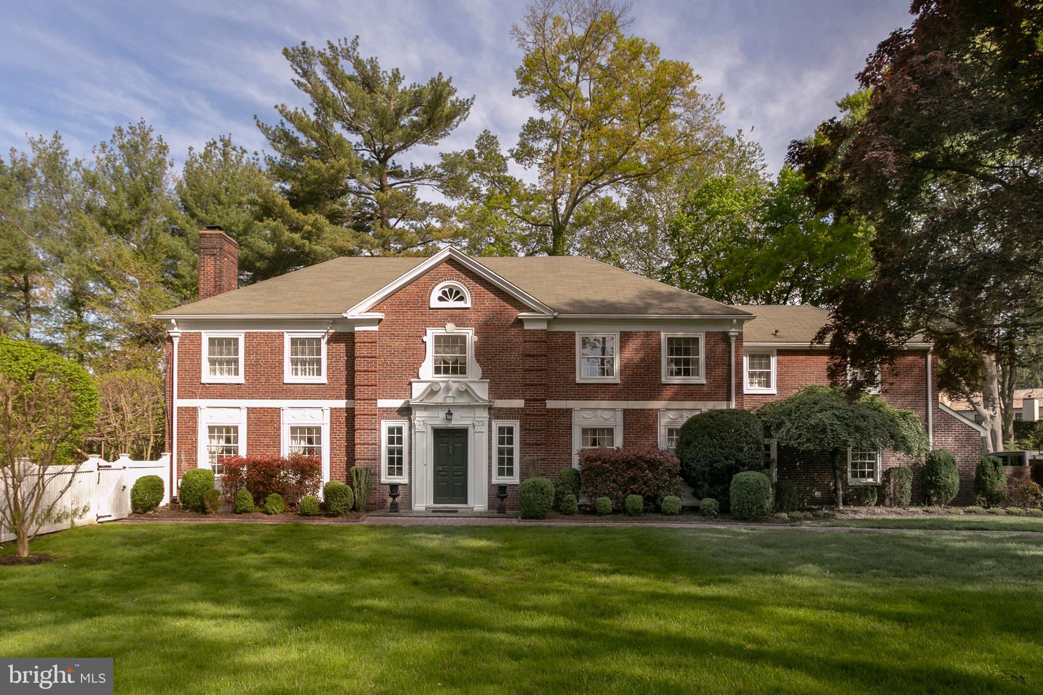 Classic Main Line Georgian that has been totally renovated with fabulous Kitchen and family room. This is the perfect blending of beautiful architectural details and moldings only found in older houses, yet a floor plan that is suitable for today s style. On the main floor, you walk into a gracious foyer with a beautiful staircase that leads you to a living room with fireplace and doors that lead to a slate patio and pool. There is a cozy study and spacious dining room with corner cupboards. Towards the back of the house is the fabulous kitchen with granite countertops, stainless steel appliances, tile backsplash and huge island which overlooks the breakfast table and family room with fireplace and wonderful cabinetry. There is also a pantry area, powder room, mud room, and doors to the 2-car garage. Off the family room, there are doors and floor-to-ceiling windows that lead to another slate patio, wonderful gardens, and pool. There is also an open staircase that leads you down to a recreation room with fireplace, exercise room and full bath. The second floor has a master with a spa bath that has a large shower double vanity and jacuzzi tub. There are 4 more bedrooms and 3 baths with a back staircase. A walk-up attic to the 3rd floor completes the upstairs. This house is full of sunlight with large windows that overlook the magnificent gardens. In a superb location that is close to shopping, dining, trains expressway and schools, this house is a true treasure.