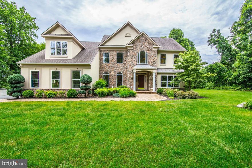 What an amazing property! Best lot on the street - last lot at end of cul-de-sac, adjacent to 81 acres of farmland and woods.Almost 3800sf on upper 2 levels with 2 fireplaces ( 1 wood, 1 propane), a kitchen that is stunning, a balcony off the master suite, and an open, light-filled floor plan.  COMCAST!!  5 car  garage ( 3 attached/2 detached).  NO HOA!  Huge unfinished LL with R/I.  MUST SEE!