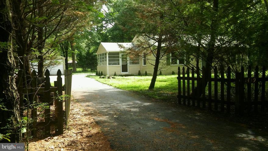Beautiful two bedroom one bath rambler, with detached garage on over half an acre of land that contains two spaces. Within 15 minutes of Annapolis. Front Screened-Porch 11'x11' - Rear Concrete Patio - Shed w/ Electric. In wall conventional oven and open living room. Pull down stairs to a floored attic, 16'x24' spacious deck. Must see!