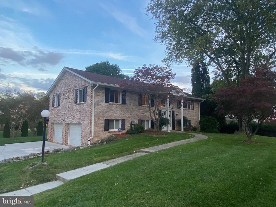 OFFER DEADLINE:   Multiple offers have been received; sellers will review all offers after deadline Monday 10/30 by 3pm.  This beautiful brick split foyer in Macalpine has been lovingly cared for by longtime owners for over 40 years.  The home has been impeccably maintained and features comfortable living spaces, large rooms with plenty of natural light, 3 bedrooms and 3 full bathrooms, a gorgeous stone fireplace, a fantastic lot with lots of trees and an ENORMOUS 48' x 12' composite deck spanning the entire rear length of the house!  Deck has two sliders for access from dining room or master bedroom, and a power retractable awning too! Full house Generac generator with balance of 10-year warranty.  Don't miss this great opportunity to find a well-cared for home in an amazing location with excellent local schools.  Zoned to Centennial HS / Dunloggin MS / Northfield ES.