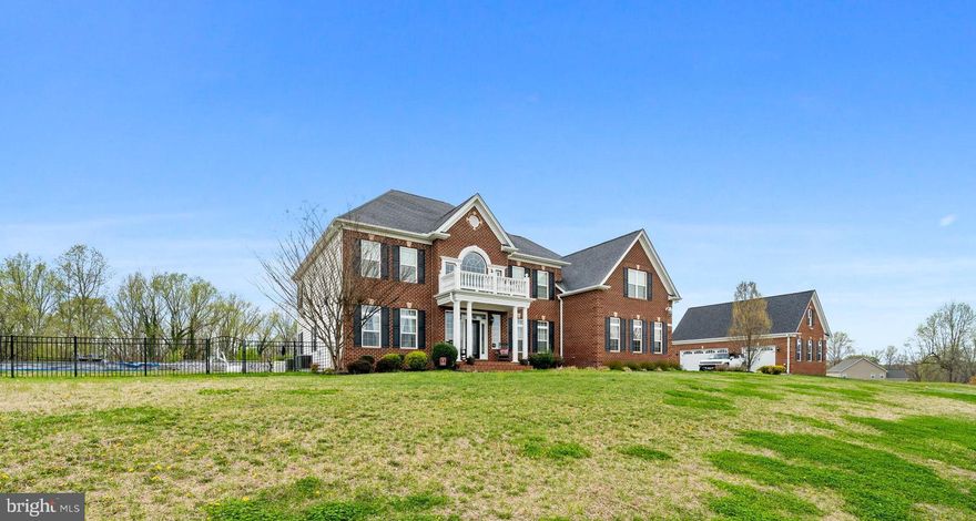 Coming Soon, QBHI's Grand, Brick front Westminster in the sought after The Lakes at Twin Shields neighborhood. This was the decorated model for this neighborhood and has so many extra features offered throughout this home.  Enter into the 2 story foyer with beautiful staircase will impress everyone! Features include a formal living and dining rooms, study, 16x16 sunroom that leads to the maintenance free decking, grand kitchen with HUGE Island, double ovens, gas cooktop, pendant lighting and opens up to the kitchen table space area and 2 story family room with gas fireplace.  Upstairs has a large owners suite with tray ceiling, sitting room, amazing bathroom with luxury cabinets, separate vanities, and pedestal tub. All this plus a custom owners closet with built in cabinets.  Bedroom 2 has it's own full bath, large bedroom 3 and 4 plus laundry on upper level.  The basement has a large gym, media room, entertaining area with wet bar, 9' ceilings, full bath and areaway to the beautiful backyard oasis.  Relax in your private backyard pool, completely fenced in.  All this plus 2 separate 3 car detached garages.  The original floorplan has an attached garage, but this home has extra finished square footage in that area with study/den and open space.  Definitely a must see!! Do not miss this home!!