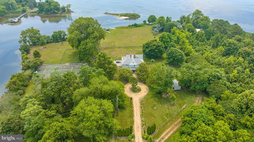 Rare opportunity to own the Estate Home of  Four Waters, which combined with the adjoining 35 acre parcel ( MLS # MDSM2013560), is one of the most majestic waterfront properties within 90 minutes
of Washington DC.  Historic estate, that encompasses the entire point of land, with approximately 2,000
feet of waterfront footage, on 38 acres of picturesque, wooded property.  Magnificent views of Saint
Clements Bay, at the confluence of the Potomac River, Saint Patrick’s Creek and Back Creek. There are
distant views of Chesapeake Bay. Enjoy views from the pier of Saint Clements Island, where Maryland
was founded in 1634 by English Settlers. The estate offers endless outdoor opportunities including a private, fenced tennis court, recently refurbished pier that can accommodate a 30-foot boat, protected waterways excellent for kayaking, paddle boarding, crabbing, and fishing, and instant access to the Potomac River and Chesapeake Bay. Pier has four brand-new pilings, ready for a boatlift.  Two marinas within one mile.  Enjoy birdwatching from the hot tub – osprey, bald eagles, Canadian geese, blue herons and many more.  Estate is extremely private as it occupies the entire tip of a peninsula. 
House was built in 1888 and has 4 bedrooms and 2.5 baths. One bathroom features a clawfoot
tub. Mostly original woodwork and hardwoods.  More than 2,000 square feet of upper and lower decks
and balconies with beautiful views of the water. Views of the Sea and Bay from the master bedroom,
living room and kitchen.  Two outdoor showers with hot water. Private fenced tennis court overlooking
Back Creek. Large, fenced yard around the immediate house for enjoying outdoor activities and keeping
pets happy. Estate is set on two parcels, one of which can be subdivided and allows for additional buildings (buyer to confirm).  The property contains an uninhabited Beach Cottage and an old tree farm with mature birch, Yoshino cherries, oaks and maples. Please reference MDSM2013560.