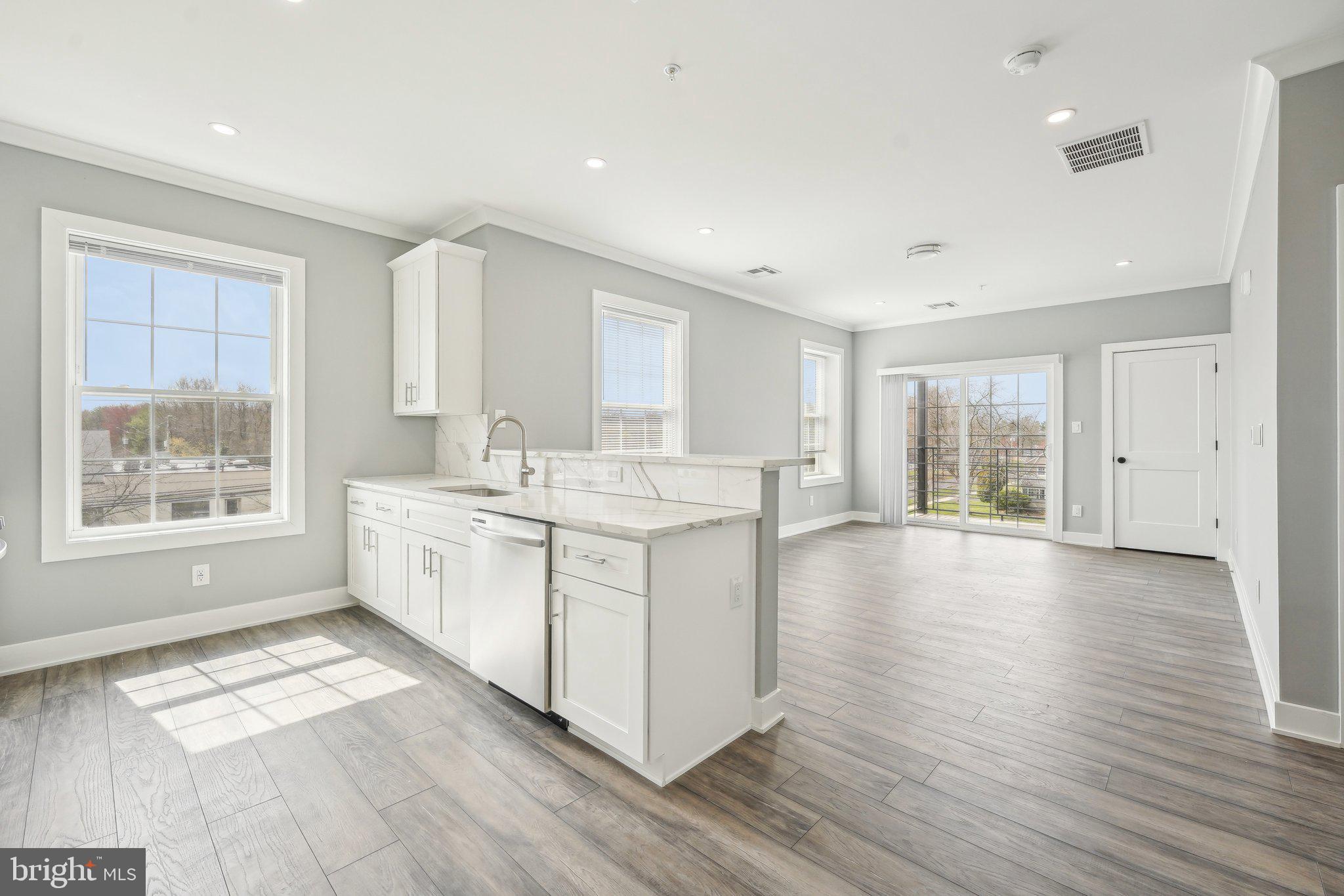 Nestled at 2421 Bristol Road in the heart of Warrington, Pennsylvania, The Warrington Place is a thoughtfully crafted residential community that blends upscale finishes, modern conveniences, and timeless style. Offering one-, two-, and three-bedroom apartment homes, the property is designed to meet the needs of today’s renters who value both form and function in a refined, suburban setting.
Inside each residence, you’ll find open-concept floorplans that maximize natural light and flow, creating a welcoming atmosphere ideal for relaxing or entertaining. The apartments feature soaring nine-foot ceilings and oversized windows, enhancing the sense of space. Gourmet kitchens are outfitted with sleek stainless steel appliances, white shaker-style all-wood cabinetry, quartz countertops, subway tile backsplashes, and oversized islands or breakfast bars in select layouts—perfect for morning coffee or evening meals. Luxury vinyl plank flooring throughout the main living areas adds a stylish, durable touch, while plush carpeting in the bedrooms provides cozy comfort.
Each apartment also includes smart Samsung appliances such as in-unit washers and dryers, allowing residents to handle laundry at their convenience. Spacious bathrooms feature modern vanities, chrome fixtures, and tiled showers or deep soaking tubs. Large walk-in closets provide generous storage, and private balconies or patios in most units offer a quiet space to enjoy the outdoors. Select homes offer premium views or corner locations for even more natural light and privacy.
Beyond the units themselves, The Warrington Place provides a well-maintained environment with controlled access entry, ample private parking, and professional on-site management. The community is located at the intersection of Bristol Road and Route 611, giving residents unbeatable access to major retail destinations and everyday essentials. Whole Foods, Wegmans, Giant, Target, Walmart, Costco, Amazon Fresh, and ShopRite are all within a short drive, making errands quick and easy. Public transportation is also convenient, with a nearby SEPTA bus stop offering a simple commute for those who prefer not to drive.
Warrington itself offers a charming, residential atmosphere with the conveniences of modern suburbia. Residents will enjoy close proximity to a variety of restaurants, local parks, fitness centers, and entertainment venues such as the Regal Cinema. The area is known for its peaceful streets, well-maintained green spaces, and an easy-going pace that makes coming home feel like a true retreat.
The Warrington Place is more than just a place to live—it’s where style meets substance, and convenience meets comfort. Whether you're a busy professional, a downsizer, or someone seeking elevated suburban living, this community delivers a lifestyle that feels both luxurious and effortless.
** Photos are of model units ** Pricing and availability subject to change on a daily basis **