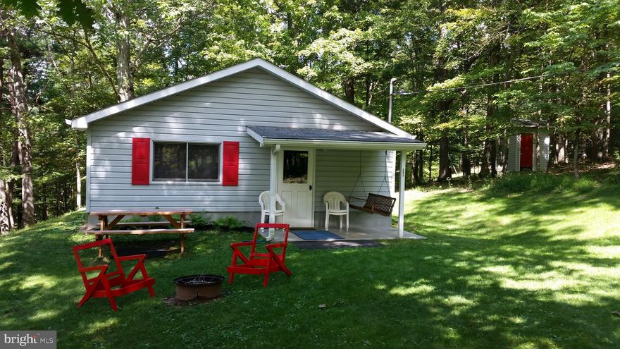 Cabin for sale in Bedford  County only 2.5 hours from York.  Just under 3 wooded acres.  Living room w/wood stove plus gas wall heater, Kitchen with stove, refrigerator, and microwave included, 1 bedroom and very nice "outhouse."  Wood shed and small storage unit included.   Beautiful setting - Abundant with wildlife and super close to Buchanan State Forest for hunting and only 20 minutes to Rocky Gap State Park for recreation.