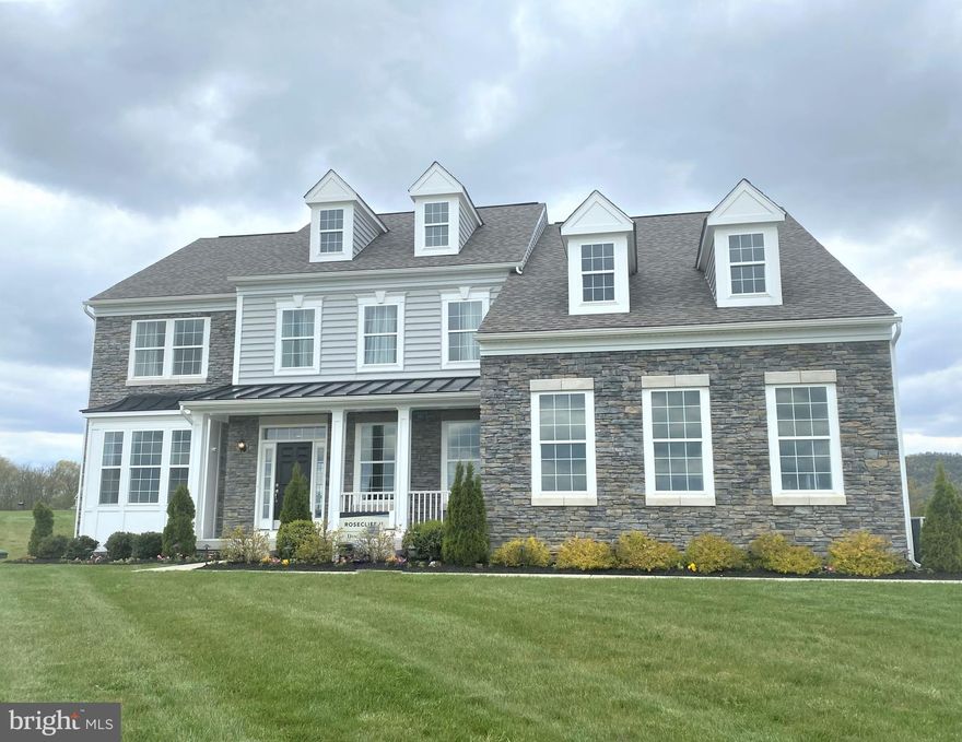 MOVE-IN TO OUR BRAND NEW ROSECLIFF MODEL!  The Rosecliff is Estate Style Living on a 1+ acre homesite. This Model home that has been talked about for years is finally hitting the market. 5 Bedrooms and 5.5 bathrooms gives this house ample space. Take advantage of buying a model home as this doesn't happen often. Impressive Foyer,  Family Room, Formal Living & Dining! The must see is the owner’s bathroom.  In addition, the side load garage is included at listed price! Finished basement and plenty of land. Easy commuter access to I-81 & Rt.9 For MD/VA.