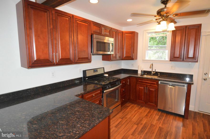 THIS IS A MUST SEE! PRICE REDUCED Beautifully Renovated Single Family Home In Parkville. GORGEOUS Oak Hardwood Floors Throughout main level Very Bright Cherry Cabinets w/Brand New SS Apps.Hunter Ceiling Fans Throughout Main Level.Stunning Main Level Full Bath w/Very Nice Tile Work.Spacious Loft Master Bedroom w/Brand New Carpet.ALL NEW WINDOWS,PLUMING,ELECTRICAL! SHOWS VERY WELL! PRICE ADJUSTMENT!