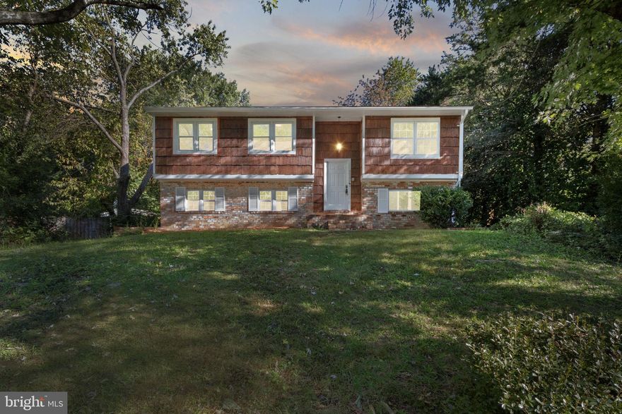 Welcome to this beautiful  5-bedroom, 3-bathroom single-family home offering the perfect blend of modern convenience and timeless charm. Spread across two spacious levels, this home is designed for both comfort and functionality.

On the main level, you'll find a fully renovated kitchen with upgraded stainless steel appliances, sleek tiled flooring, and plenty of counter space for cooking and entertaining. The living room and common areas feature luxurious new vinyl plank flooring, giving the space a fresh and modern feel. The hallway bathroom has been tastefully updated, and the primary suite boasts its own private full bathroom, complete with a tiled standing shower and a serene window overlooking the peaceful backyard trees. Enjoy the ambiance of upgraded recessed lighting throughout, complemented by an electric fireplace for cozy evenings.

The lower level offers 2 adjoining bedrooms, an oversized full bathroom, and a convenient full-size laundry /mud room with both interior and exterior access. Step outside from the kitchen onto a spacious deck, perfect for gatherings, with connecting stairs leading to a paved patio below—ideal for outdoor entertaining.

With a 3-car driveway and beautifully landscaped front and back yards, this home is move-in ready and offers all the amenities you’ve been searching for.