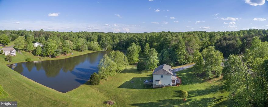 Peace & quiet-Country Living! This stately Col w/hip roof, country front porch & rear deck overlooking a community pond that offers great fishing. Hm features 4 BR's, 2.5 BAs, full unfin basement w/RI plumbing for futures expansion & 2 car gar. FR w/FP off Kit w/island & eating counter. Lots of storage & WIC. Laundry on upper level, MBR w/sitting room & Lg BR/bonus RM w/WIC. ComCast Available!