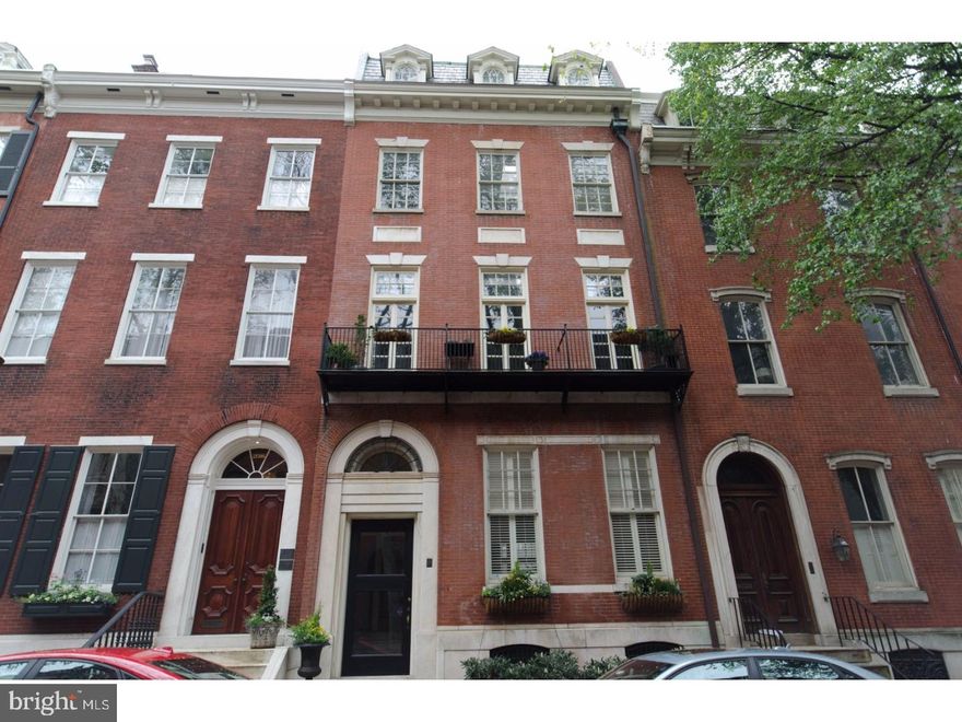 Stunning Delancey Place Brownstone Condominium.   Gleaming with natural light, this  Rittenhouse Square residence expounds Delancey Place living to the core. Upon entering the first level condominium, one is overcome by its rich character and details. Enter into a traditional large living room with a high ceiling, moldings, wood floors and fireplace.  Original pocket doors lead you to the open dining and custom kitchen. Kitchen complete with commercial stove, Bosch dishwasher, Sub-zero refrigerator, Dacor range, stone countertops and wood cabinets - large window overlooks private bi-level deck with a Weber gas grill. Powder room and storage off this area.  Currently configured as a 3 bedroom with 2 1/2 full baths, the peaceful master bedroom faces south with an en-suite bath.  A lower level second bedroom accommodates  a queen-sized bed and the 3rd bedroom/den share the lovely tile bath. Other noteworthy interior details include high ceilings, excellent light with large windows,  hardwood flooring thru- out, crown moldings, wood-burning fireplaces, custom closets, custom milled built-ins,and storage, central  zoned HVAC, and custom window treatments. There is also a private basement storage unit included in the sale. The gas grill is connected to a gas line.