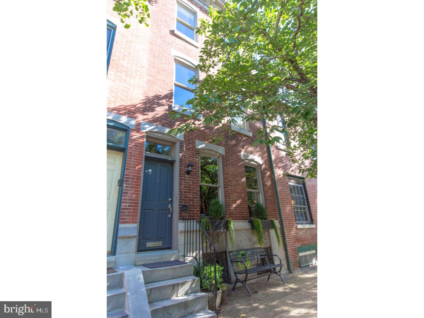 Classic Fitler Square townhome with original character and high-end updates. Enter this designer styled home through an enclosed vestibule, into an open living/dining room with high ceilings, original blue stone mantle with built in shelving surround, and incredible natural light. The custom kitchen has floor to ceiling cabinetry, Subzero refrigerator, Bosch dishwasher, Viking double oven, gas range, breakfast bar, office nook, and a wall of windows. Off the kitchen are french doors that lead out to a charming bricked patio. The first floor also features a conveniently located powder room. The 2nd floor master bedroom is en-suite to a zen-like bathroom with dual stone-top vanity, and soaking tub with frameless glass doors. The master bedroom is complete with built-in wardrobe with customized closets. Also on the 2nd floor is an additional bedroom. The 3rd floor bedroom (currently used as a den) is bright and open with built-in shelving, laundry closet and full bathroom with pedestal sink and glass enclosed shower. From the 3rd floor, walk out to the roof deck with amazing skyline views. 2427 Pine is located on a charming tree lined street in coveted Fitler Square. Incredible location surrounded by neighborhood stables like Rival Brother's, the Schuylkill River park with running/bike path, and the Saturday Fitler Square Farmer's market. Very convenient to PENN, CHOP, Rittenhouse Square, and all that Center City has to offer.