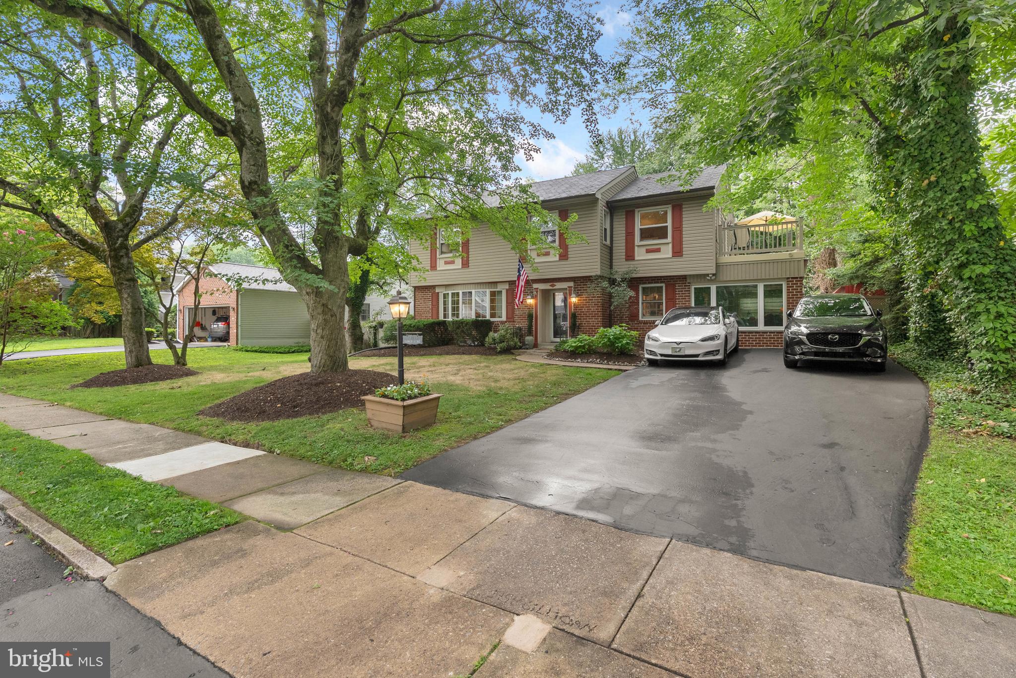 Privacy, Charm & Resort-Style Living on a Tree-Lined Street.
Welcome to 332 Franklin Avenue, a beautifully updated 3,300+ sq ft colonial nestled on one of the most desirable tree-lined streets in Springfield — where kids safely ride bikes and neighbors still wave hello. This move-in-ready 5-bedroom, 3.5-bathroom home offers the perfect blend of timeless curb appeal and modern comfort, set within the award-winning Springfield School District.
Out front, mature trees, manicured landscaping, and a 4-car driveway with an EV charger create a picturesque first impression. Step inside to a tiled foyer with a coat closet, opening to a formal living room with gleaming hardwood floors, crown molding, wainscoting, and a sun-filled bay window. The adjoining dining room is perfect for hosting family dinners or holiday gatherings.
At the heart of the home is a spacious eat-in kitchen featuring solid wood cabinetry, granite countertops and backsplash, stainless steel appliances (including a trash compactor), and a sunny breakfast nook. A cozy den just off the kitchen offers the ideal space to relax with a book or movie night. A convenient powder room completes the main level.
Step outside and you’ll find a private backyard retreat that feels more like a resort. Designed for entertaining and relaxing, the fully fenced yard features an 11.5-foot-deep heated pool, 8-person hot tub, 50-foot slate patio for dining under the stars, built-in outdoor speakers, two storage sheds, and plenty of open space for play and lounging. It’s rare to find this level of privacy and space, especially in such a prime location.
The finished basement adds even more versatility, with a large rec room or media space, plus a private in-law suite with a separate entrance, full bath, laundry area, and kitchenette potential—ideal for guests, extended family, or a rental setup.
Upstairs, the primary suite is a private sanctuary with plush carpet, a walk-in closet, an updated ensuite bath, and a private fiberglass deck overlooking the backyard—perfect for morning coffee or evening stargazing. Three additional spacious bedrooms and a hall bathroom complete this level. A large attic offers abundant storage.
Additional upgrades include:
• Hardwired speaker system throughout
• Whole-house fan for energy efficiency
• New heater and water heater
• Updated utilities
Location perks: Just off Baltimore Pike with quick access to Rt-1 and I-476, close to shopping centers, parks, country clubs, the YMCA, and walking distance to Springfield’s brand-new high school.