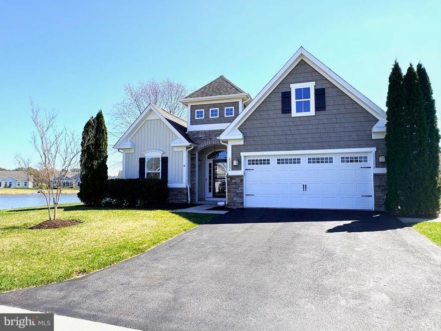 Experience panoramic water views from this beautiful home, where the entire length of the house and backyard face the serene pond, offering picturesque scenery both inside and out. Just two blocks from the community beach and kayak launch, the property includes a Hobie Cat kayak with wheels stored in the garage for your convenience. Featuring 3 bedrooms plus a den, a separate dining room, a spacious kitchen with a breakfast area, a family room, a sunroom, and a three-season room, this residence boasts a versatile and open floor plan.
Enjoy premium upgrades such as hardwood floors throughout, wainscoting and crown molding, granite countertops, and stainless steel appliances—including a brand new refrigerator, washer, and garbage disposal. One guest bedroom expanded by the previous owner, now offers a sliding door to a private paver patio. Step out onto the large paver and stamped concrete patio through the three-season porch, where you’ll find full water views, a cozy fire pit, and an electronic awning. The two-car garage features an epoxy floor and a sizable stainless steel refrigerator/freezer. A beautiful wrought iron fence surrounds the backyard, complemented by an outdoor shower for added luxury. This exceptional home truly has it all!