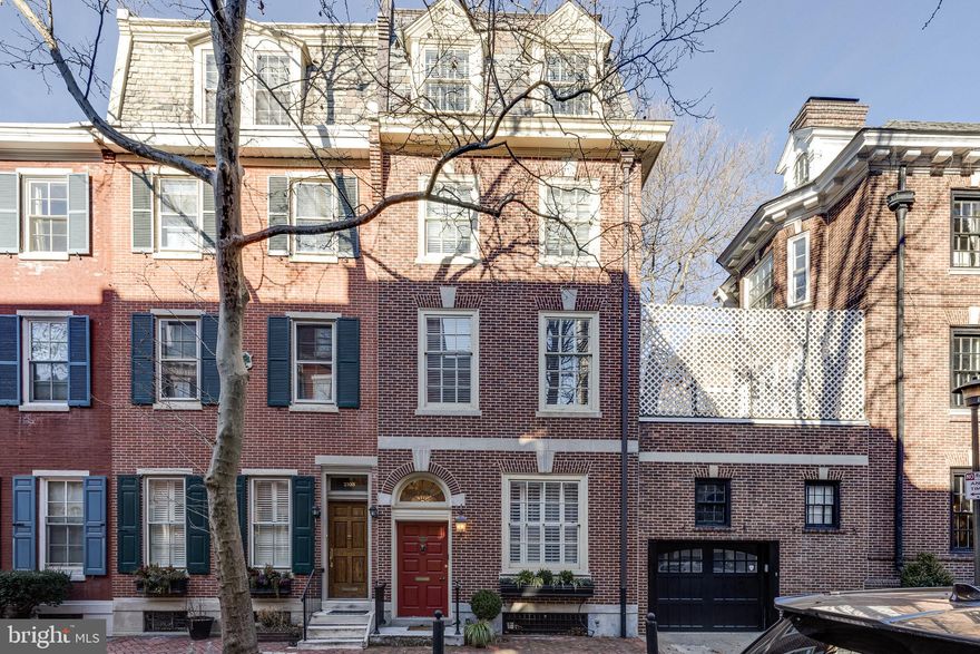 Welcome to this charming and historic townhouse nestled on one of the most desired, tree-lined streets in the city, Delancey Place, in the Rittenhouse Square neighborhood. This 7,150 sq. ft. townhouse restoration blends classic Philadelphia architectural details with the comforts of modern living.  A must-see, 4-story home featuring 5 bedrooms, 5 full bathrooms (4 en-suite), 3 powder rooms, 4-car garage with lift, an elevator that services all floors, and 2 outdoor terraces with the most incredible city views.  You are welcomed into the home by an elegant foyer with a grand staircase.  The front entertaining room is an extra living space that can be closed off and private to accommodate an office or cozy den with a gas burning fireplace and large windows overlooking the quiet street.  Back through the foyer is the spacious formal dining room with elevated ceilings large enough to accommodate any size gathering.  Immediately adjacent is the full catering kitchen & powder room. In the rear of the first floor, a 4-car garage has been added with a car lift to accommodate an extra 2 parking spots. The front family room is oversized yet intimate with a wood-burning fireplace, large windows, beautiful built-in bookcases, and an adjacent wet bar area. Down the window-lined hallway to the north end of the home is the gourmet eat-in kitchen, with oversized windows and glass doors to a charming terrace overlooking Cypress St. The kitchen features custom cabinetry & millwork with granite countertops, Wolf 36''gas stove, Wolf built-in convection oven/microwave, Wolf 30'' wall oven, Bosch dishwasher, U-Line wine cooler and a 48'' Sub-Zero side-by-side refrigerator/freezer, plus a gas fireplace. This floor is complete with a hall powder room, a closet for storage, and a custom pantry. The third and fourth floors are dedicated to all of the home's bedrooms. The main suite sits at the front of the third floor and features a custom outfitted walk-in closet, 4 additional closets, a luxury Carrera marble bathroom with dual sinks, a water closet, and a fully enclosed "wet room" with two shower heads, body sprays, and a claw foot tub. The spacious second bedroom is on the north side of the house with ample size closets, large windows looking over Cypress St., an en-suite bathroom with Carrera tile floors, double sinks with marble vanity, and a Jacuzzi tub. Also on the third level is an extra den that can also be used as a game room, an office or even a nursery. Next to that space is a laundry room. The fourth level features 3 additional guest bedrooms, 3 full bathrooms (2 en-suite) plus an additional family room with full glass sliders that open to a large terrace. This extravagant indoor/outdoor space is perfect for relaxing or entertaining guests with full skyline views & features a wet-bar area w/ a mini-refrigerator, dishwasher, and sink. The full basement has three large rooms for storage, plus a half bathroom, and can be designed to fit the preferences of the future owners. The entire home has been newly painted in a nice neutral palate.  Additional highlights: 4 HVAC zones, Control 4 "smart home" system that allows you to access and control right from the mobile app.