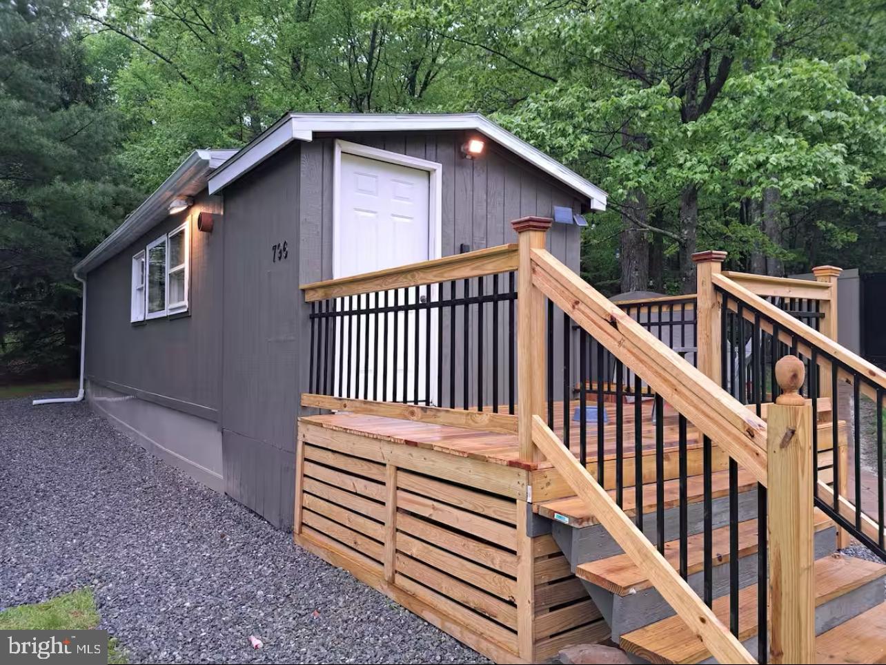 This affordable recreational camp offers a perfect spot to relax after a day of hunting or ATV riding. The 432-square-foot modular building, built in 1980, includes a combined kitchen and living area, plus a sleeping area with bunkbeds. Situated on 0.63 acres of mostly cleared land, the property has no water or sewer but is equipped with electricity and an outhouse. The camp features small porches at both ends and a newer roof. There is a 30 amp outlet for an RV on the exterior of the building. Located close to state game lands and the Snow Shoe Rails to Trails, this property is ideal for outdoor enthusiasts. The property has been used most recently as an Air-Bnb. A powerline right-of-way runs through the land as well. Public water hook-up available on road.