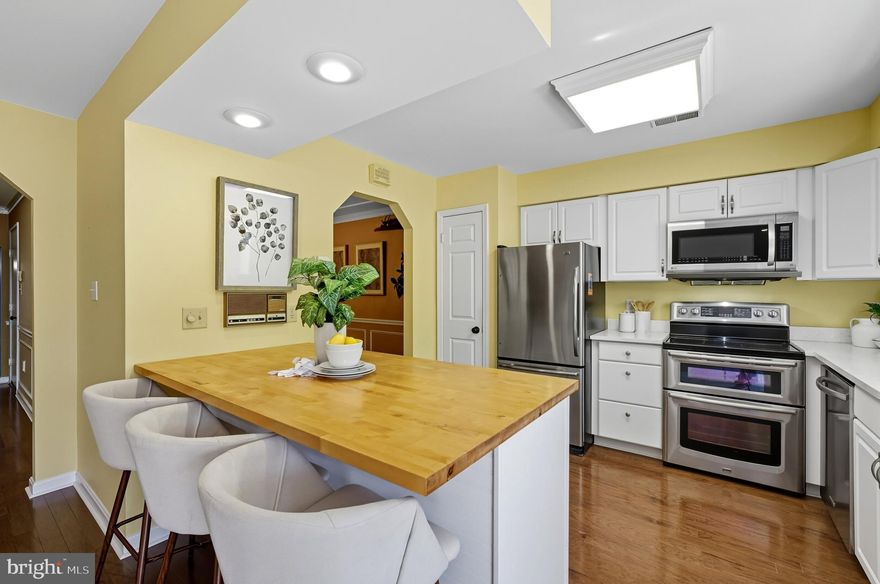 If you are looking to get into the popular, 55+ community of Heritage Harbour in Annapolis, this is a wonderful opportunity! This large, 3 level townhouse won't force you to part with all of your treasures as there is a place for everything! Offering 3 full levels of living space you can relax, entertain, work, pursue multiple hobbies, enjoy hosting company and still stay organized! 
You are welcomed into the large living room from your covered, front porch. The generous room size can accommodate large furnishings. There is a convenient powder room and storage closet in the hallway along with access to your garage. Real hardwood floors flow through the entire first level. The beautiful dining room boasts delightful, custom molding and trim work. The dining room is conveniently located with a separate entrance to the kitchen. The kitchen appliances and countertops have been updated to stainless steel appliances, granite and butcher block. There is a lot of cabinet space plus a dedicated pantry. The attractive, wood topped breakfast bar will be a favorite perch for sipping coffee while chatting on the phone or checking your email. Adjacent and open to a comfortable family room you will no doubt spend a lot of time in this space.  French doors open from the family room to a large deck w/ an awning. The deck was recently refurbished & restained. You'll enjoy this beautiful spot for many months throughout the year. A storage closet on the deck gives you a place for cushions and potting equipment. 
The upper level offers a spacious master suite with a walk-in closet and extremely large master bathroom. With a double vanity, separate shower and tub, large linen closet and skylight you will be sighing, "Calgon, take me away"!  There is a second en suite bedroom on this level with a tub/shower combo. A 3rd bedroom has been outfitted with loads of shelving and storage. Do you work from home? Do you have a book collection? How about photo albums or a genealogy study? There's room for all of that and more.  A unique and especially attractive feature of this model is the extra sitting room with custom book shelves tucked neatly between the bedroom areas for letter writing or late night reads. There is a very large storage area on this level as well. 
In addition to all of this usable, finished, living space you will also find a full, walk-out basement! Approximately half of the basement is finished with more shelving and cabinetry, a half bathroom and a level walk-out to a private, slate patio with built-in planters. The deck posts/supports were also recently redone & a the fence has had a facelift. The finished area basement space could be a recreation room or guest quarters. Bring your imagination .  .  .  what do you want your life look like for the next 10 - 20 years? To top it all off there is a genuine workshop in the basement with a workbench and even more storage space for tools, paint, and all the other materials needed to maintain your beautiful home and pursue your passions and hobbies. You will also find the washer (rebuilt - because they don't make 'em like they used to) and dryer and a utility sink for tough laundry items and easy cleanups after gardening, painting or woodworking. 
The owners have maintained the home extremely well and there are many upgrades and improvements that have been made including, but not limited to the Trane heat pump, Rheem water heater, 6 month roof & gutter check-ups and maintenance , a pest control contract , electrical upgrades and whole house duct cleaning. 
Heritage Harbour is an amenity rich community including a golf course, restaurant, tennis & pickleball courts, Clubhouse with fitness center, indoor and outdoor pool, and access to the South River including a community pier, boat slips, canoe & kayak racks. There is a one time, up front Capital Contribution fee of $2,000 due at closing.