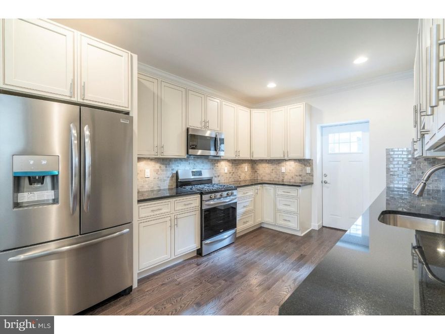 2024 McKean Street is the stuff dreams are made of, and would be an excellent home to turn into an Airbnb! Enter into the spacious living room, which features beautiful hardwood flooring and a gas fireplace. Continue through the dining room and back into the gourmet kitchen, where you'll find stainless steel appliances, under-cabinet lighting, granite countertop, a custom tile backsplash, and tons of storage. Step outside and check out the fenced-in patio, where you can enjoy a cup of coffee in the morning. On the second and third floors, you'll find three bright and sunny bedrooms, both with ample closet space, and two full bathrooms. Don't forget to check out the roof deck, where there is plenty of space for outdoor entertaining, and gorgeous views of Center City. The lower level is the perfect spot for a home office, family room or even an additional bedroom. This home is just steps from several great restaurants and bars and is just a short walk from public transportation and Center City. With all this to offer, and a tax abatement pending approval, what are you waiting for? Schedule your showing of 2024 McKean Street today! *Please note, some photos have been virtually staged to give an idea of how the various spaces could be used. Please check OPA for 2019 taxes due to possible citywide reassessment.