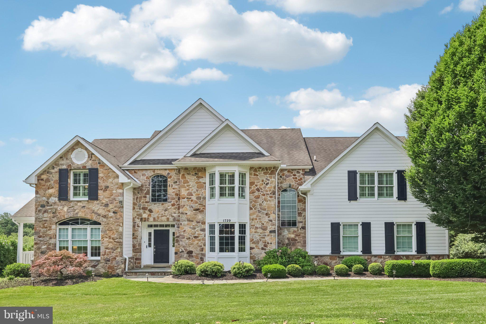 Welcome to 1729 Towne Drive, an exquisite stone-front home nestled on a premium, private lot in the prestigious Clocktower Woods community of East Goshen. This impressive Chelsea model—the largest floor plan in the neighborhood—offers approximately 6,900 square feet of beautifully updated living space across three levels, including 5 Bedrooms, 5 Full Baths, and 2 Half Baths. Surrounded by rolling open space, the outdoor living area is a true highlight, featuring an expansive composite deck perfect for entertaining or enjoying peaceful evenings with panoramic views of the lush, private rear yard.
Inside, the main level is a showcase of thoughtful design and high-end finishes. Gleaming hardwood floors, custom millwork, and a dramatic two-story Foyer with transom windows set the tone. The formal Dining Room impresses with French doors, detailed wainscoting, and a large bay window. This level also contains a living room and a private Study with access to the cozy front porch.
The gourmet Kitchen is ideal for chefs and entertainers alike, featuring ceiling-height cabinetry, a Thermador commercial-grade gas range, Sub-Zero refrigerator, farmhouse sink, tumbled marble backsplash, and an oversized center island with pendant lighting and built-in appliances. A custom Butler’s Pantry with wood countertop and built-ins adds both style and functionality. A bright Morning Room provides the perfect spot to start your day with a serene view.
At the center of the home is a spectacular two-story Family Room, showcasing a beamed ceiling, floor-to-ceiling windows, and a cozy gas fireplace. Also on this level are two elegant Powder Rooms, a large Mudroom with custom built-ins, and a rear staircase for added convenience.
Upstairs, hardwood floors continue throughout the hallway. The luxurious Primary Suite features a tray ceiling, a sunlit Sitting Room (ideal for a home office, mindfulness, or meditation space), two custom walk-in closets, and a spa-inspired Primary Bath with granite vanities, a freestanding soaking tub, and an oversized shower with rain head and dual body jets. Four additional Bedrooms complete the second floor—two with ensuite Baths and two that share a beautifully renovated Hall Bath with double vanities and a glass-enclosed tub/shower. All bedrooms include custom-designed closets. A spacious second-floor Laundry Room with cabinetry and folding area offers everyday convenience.
The professionally finished walkout Lower Level offers over 1,800 square feet of flexible living and entertainment space. It includes a full custom Bar with cabinetry, refrigerator, and dishwasher; a large Media Room with fireplace and full-size windows; a separate Gym room with rubber flooring and mirrors; and a versatile Game Room. This level also features a Full Bath, second Laundry Room, Dressing Room, and walkout access to the rear patio with Hot Tub—creating the ultimate space for recreation, fitness, and relaxation.
Additional Features:
Whole-house backup generator (services full panel)
Whole-house surge protector
Surround sound throughout
LED landscape lighting (front & back)
In-ground irrigation system
Planned community with no HOA fees
Located in the award-winning West Chester School District, with easy access to top-rated private schools, train stations, downtown Malvern & West Chester, shopping, gyms, and the scenic parks and trails of East Goshen Park and Applebrook Golf Club.
📍 This is more than a home—it’s a lifestyle. Schedule your private tour today!
