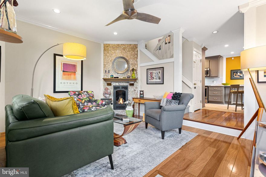 Tucked within a gated, brick-paved courtyard of just eight homes, 2030 South St #A offers the rare feeling of a country-style townhouse in the heart of the city. Set back from South Street, Unit A enjoys notable quiet and privacy, while still benefiting from an ultra-convenient location. This pet-friendly courtyard community provides added security and shared maintenance of the courtyard and front walkways, creating a well-cared-for and welcoming environment. In addition to the gated courtyard setting, the home is equipped with an ADT security system covering both exterior doors and all first-floor windows, offering enhanced safety, monitoring, and peace of mind for everyday living and travel. Unit A features DEEDED PARKING directly adjacent to the home and boasts two private patios—front and side—ideal for gardening, grilling, relaxing, or entertaining. One of only two homes with access to the rear egress alley, the property also offers additional gardening potential and a keyed exit to 21st Street. The home is filled with NATURAL SUNLIGHT on all three floors, with exposures to the south, west, and north. Major exterior and system improvements provide long-term peace of mind. The full roof was replaced in 2021. A new whole-house central HVAC system (2023) ensures year-round comfort, complemented by a third-floor mini-split system (2025) to equalize temperatures in the upper level. Exterior stucco walls were professionally resealed to mitigate moisture intrusion.Enter the home into a one-step sunken living room, warmly appointed with a gas fireplace insert and custom mantle. Brazilian Teak Hardwood flooring runs throughout the living room and both bedrooms, adding durability and timeless style.The contemporary kitchen renovation, completed in August 2025, is both functional and refined. Updates include refaced cabinetry with all-new cabinet doors, roll-out drawers, and a new bank of cabinets with an eat-in counter. The kitchen is outfitted with stainless steel appliances, including a Bosch dishwasher, microwave/convection unit, zero-clearance refrigerator with interior water and ice maker, and a new electric range (with the gas valve still accessible for future conversion). Additional highlights include under-cabinet lighting with dimmer and color-change selector and a new Andersen sliding glass door with lock, enhancing light, flow, and security. The second floor is accessed by two sets of six stairs and opens to a versatile open studio / landing space—perfect as a child’s play area, music room, office, or creative space—enhanced by an articulating wall. This level also features a second bedroom or den with attractive 3 piece wall unit, including center glass door display unit, a large cedar-lined walk-in closet, an additional 6-foot cedar-lined wall closet, and a full bathroom. The third floor, again reached by two sets of six stairs, is a private en-suite retreat complete with bedroom, bathroom, and laundry area. The bathroom was remodeled in 2021 to include a tiled walk-in shower with handheld shower-head, vertical drain, marble bench seat and curb, and thoughtful finishes throughout. The relocated in 2025 laundry area includes a full-size stacked washer and dryer vented to the exterior, along with an additional work area and generous storage. Closets abound on every floor, offering exceptional storage rarely found in city homes.The partially finished basement adds valuable utility, another functional space for projects, workshop or exercise. Mechanicals are enclosed in 2 framed double door closets. It features two sump pumps, a dehumidifier, an above-ground baseboard drainage system, and drainage holes drilled into cement block walls. The basement is DryLocked (painted walls), annually maintained, includes drywall with minimal mechanical enclosures, and has a sealed and painted floor, making it ideal for storage, hobbies, or workspace. Book your tour today!