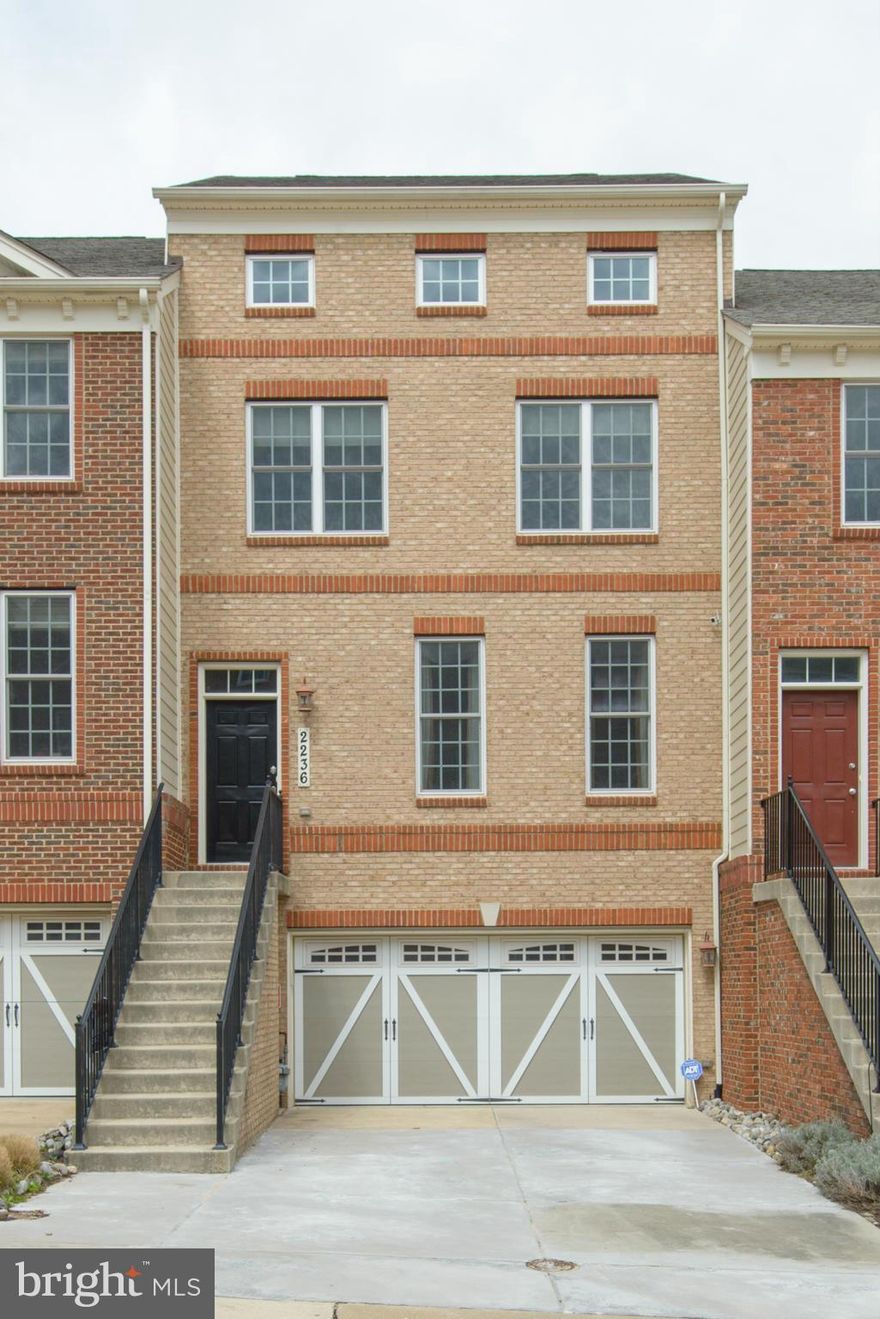 Amazing open concept four level townhome w/2 car garage & beautiful wooded view. Harwood floors on the main level which include gourmet kitchen with 42" cabinets, granite and stainless steel, breakfast nook, family room with fireplace, spacious living room and formal dining room, spacious master suite with Spa-like master bath, custom blinds, 2 zone hvac, +++