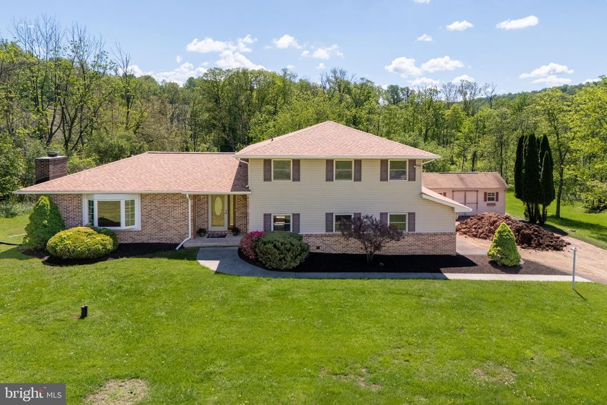 HIGHEST AND BEST OFFERS DUE MAY 18TH 5:00PM:  Discover the POTENTIAL of this 2.1-acre property nestled in DESIRABLE Lower Saucon Township. Tucked away in a PEACEFUL SETTING, this home offers the perfect canvas for those looking to start a new chapter. A NEW ROOF and GUTTERS were just installed in April 2025 on this beautiful SPLIT-LEVEL home, and is just waiting for your interior updates and finishing touches. Offering a spacious primary bedroom with en-suite bath, 2 additional bedrooms, full bath and a powder room, this home has plenty of space. The kitchen offers a cozy breakfast area, perfect for lazy mornings, along with a separate dining room for formal entertaining. The spacious family room features a wood-burning FIREPLACE and large BAY WINDOW, offering stunning views and flooding the space with NATURAL light. A bonus family/living room, 2 car attached garage, and unfinished basement complete this home, ready for someone to make it their own. Surrounded by MATURE TREES and OPEN SPACE, the lot provides privacy, and a lovely stream meanders through the back of the property. With room to expand, and the tranquility of country living, all while being just minutes from shopping, dining, and major routes in the Lehigh Valley, this is a rare opportunity to create your DREAM HOME in a PICTURESQUE location.