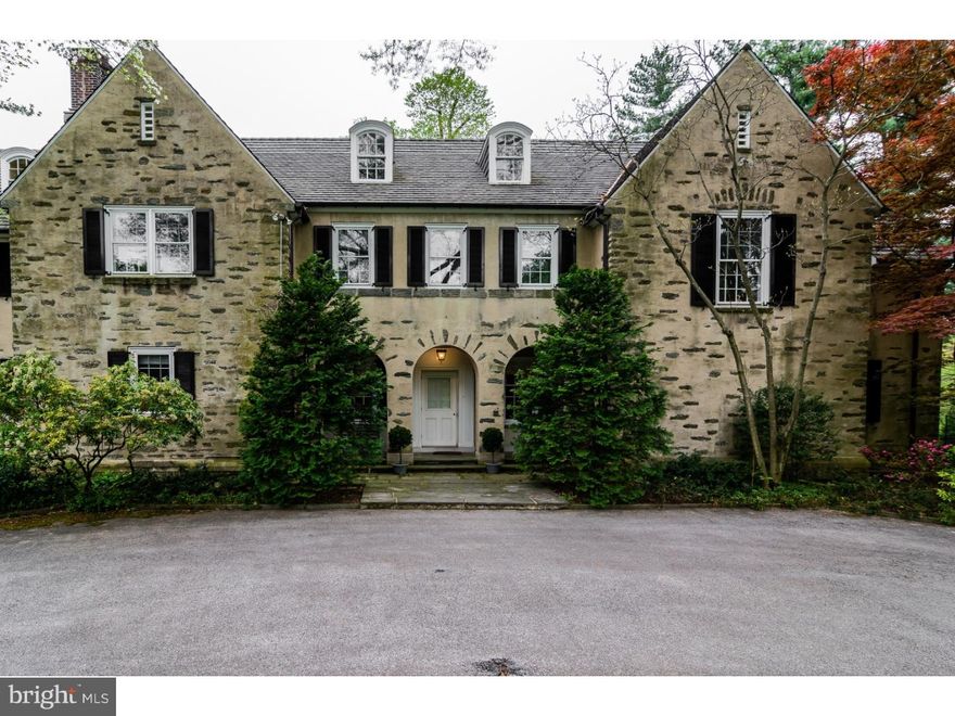 We are extremely proud to offer 6910 Wissahickon Avenue, a truly spectacular property; originally a Tudor Revival designed  by Charles Barton Keen in 1911, it underwent an extensive renovation by noted architect Sydney Martin in 1930. Feast your eyes on this magnificent residence with handsome Ludowici tile roof beautifully sited on 3.5 acres. The first floor features a brightly lit, gracious floor plan with coveted architectural details and moldings, meticulously and lovingly maintained. Large entry hall with dramatic spiral staircase, formal living room elegantly appointed with Gracie wallpaper, large formal dining room with fireplace, handsome wood paneled library and sunroom. Fabulous Smallbone gourmet kitchen with all the bells and whistles and adjacent family room. Sunroom opening onto a large flagstone and brick terrace. Upstairs, in addition to a gorgeous master suite with a fireplace and terrace, two floors of family bedrooms, baths, offices and comfortable living spaces. Lower level offers additional family room with kitchen opening onto beautiful har-tru tennis court just a few steps from the pool. The coach/carriage house with 5 bays, and large, well appointed two-bedroom, two bath apartment above completes the picture, creating an extremely private setting, a short drive to Center City or the village of Chestnut Hill, and the Wissahickon trails. It simply doesn't get any better than this!