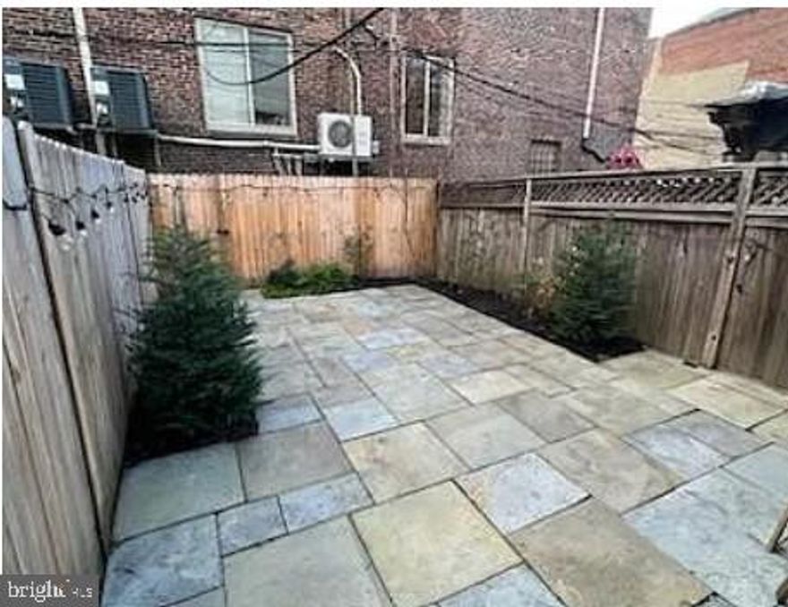 Charming 2‑bedroom, 1‑bathroom condo in the heart of Graduate Hospital with an unbeatable location. Enjoy an easy walk to Center City and Rittenhouse Square, making commuting and city living effortless. This home features hardwood floors throughout, central air, and free in‑unit laundry. Monthly costs are kept low with water and gas included. One of the standout features is the huge private backyard/patio, perfect for entertaining, gardening, or relaxing outdoors. Close to shops, dining, parks, and public transportation—this is city living at its best.