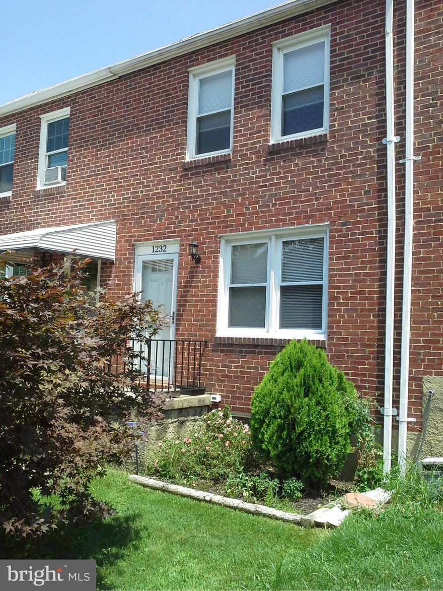 Stop paying rent. This solidly built brick THS is the perfect starter home. Located on a quiet one way street and facing open space gives you extra parking and the feeling of peace and nature.  Kitchen has been updated with lots of cabinets. The hardwood floors are richly finished and the room sizes are generous. Cozy clbrm or BR on lower level with half bath. Brand new high efficiency  furnace.