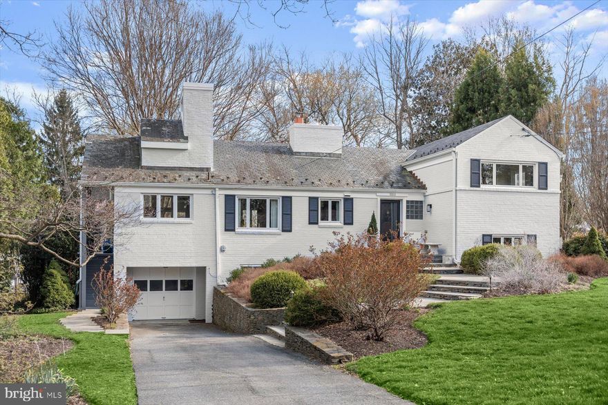 Sited on a beautiful, treed .38 acre, this classic 4-level split offers very large rooms, an attached one-car garage, gracious indoor-outdoor entertaining space and lovely views throughout.

On the first floor, a center hall leads to a traditional living room with a warm gas fireplace and two walls of built-in bookcases open to a large, formal dining room. The adjacent kitchen features warm wood cabinets, a gas stove and granite countertops and opens to a stunning family room with cathedral ceilings and two walls of windows with beautiful backyard views.  Charming ladder stairs lead from the family room to a loft, perfect as a playroom or office with skylight and balcony. Off the family room, an expansive wraparound deck with separate stairways to the flagstone patio and driveway offers wonderful warm-weather entertaining and relaxation space.

Two bedrooms on the second level include an oversized primary suite with bay windows offering bright, serene reading space, along with a book alcove and large walk-in closet. An ensuite primary bath features double sinks, a luxurious soaking tub with window, and separate walk-in shower. An updated hall bathroom services the additional bedroom on this level. There are two additional bedrooms and full bath on the lower level – perfect for guests or an au pair – while a fully above-ground basement level features a large rec room with built-in bookshelves and a second fireplace. The large storage/utility room provides space for the laundry area as well. There are two exits – to the driveway and flagstone patio – on this level.

With space, updates, charm, and a desirable Rock Creek Hills location, this home checks all the boxes. Off the Connecticut Avenue corridor and close to 495 and Rock Creek Park, you’re just moments from Kensington’s shops and restaurants, Antique Row, MARC train and Farmers’ Market; and a short drive to all Friendship Heights and downtown Bethesda amenities. Welcome home!