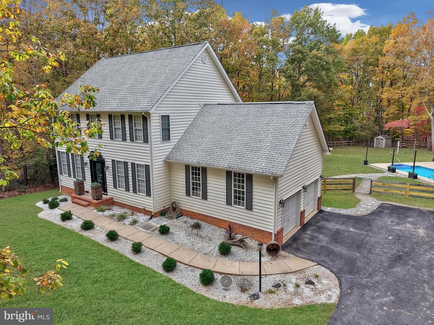 Stunning Colonial Retreat with In‑Ground Pool on a Serene, Wooded 2+ Acre Lot with a Finished Basement!

Discover this beautiful center‑hall colonia,  in sought after Estates of Chancellorsville,  offering the perfect blend of elegance and tranquility. Nestled on a private, wooded lot, this home feels like your own peaceful oasis. Enjoy summer days relaxing by the sparkling in‑ground pool or entertaining in the spacious backyard. From the expansive deck, pergola, and firepit to the beautifully landscaped grounds, you’ll savor the quiet and privacy this property provides.

Inside, the main level showcases hardwood floors and a thoughtful layout designed for both everyday living and entertaining. The newly remodeled kitchen features gas cooking, abundant cabinetry, and modern finishes, opening seamlessly to the family room where a cozy gas fireplace creates a warm and inviting atmosphere. A formal living room and dining room add timeless elegance, perfect for gatherings and celebrations. The main level also includes a powder room and a versatile office that can serve as a fourth bedroom or flex space, offering options to suit your lifestyle.

Upstairs, the owner’s suite is a true showpiece, designed to impress with its sheer size and thoughtful details. A striking accent wall adds character to the vaulted bedroom, while the expansive layout easily accommodates a sitting area or reading nook. The oversized walk‑in closet provides abundant storage, and the updated spa‑like bathroom features dual vanities, a garden tub, and a walk‑in shower — blending modern finishes with everyday luxury. Two additional bedrooms upstairs are equally spacious, offering comfort and versatility for family or guests. They share an upgraded hall bath, beautifully refreshed with contemporary fixtures and finishes, ensuring both style and convenience.

The finished basement offers a tremendous amount of space and endless possibilities. With its walk‑out access and full bath, it’s ideal for recreation, a home gym, media room, or even a guest suite. Whether you envision entertaining, hobbies, or simply extra storage, this level provides the flexibility to bring your imagination to life.

This home combines practical updates with timeless charm, offering everything from everyday comfort to exceptional entertaining spaces. With over two acres of wooded privacy, an in‑ground pool, and a location in one of the area’s most desirable communities, this colonial retreat is ready to welcome you home. ***new roof to be installed before closing with a full price offer ***