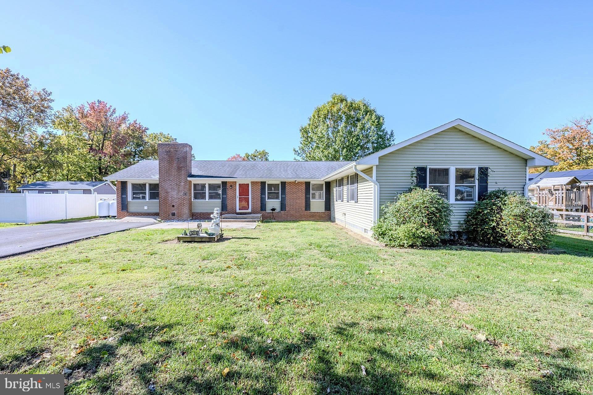 Welcome to this spacious rambler in the sought-after Ramsey Bay community! This 4-bedroom, 2.5-bath home offers an inviting open layout and plenty of upgrades throughout. As you enter, you’re greeted by a large open living room featuring a floor to ceiling brick fireplace with a pellet stove and durable laminate wide plank flooring that flows through the main living areas. The open-concept design connects seamlessly to the dining area, complete with built-ins and a bar with beverage fridge, perfect for entertaining. The oversized kitchen includes an island, abundant cabinet space, dual smooth top ranges, a built-in microwave, a large refrigerator, freezer, and dishwasher. Off the kitchen, you’ll find a convenient laundry room and an all-season sunroom with soaring cathedral ceiling and walls of windows filled with natural light. Step outside to enjoy two separate decks—one on each side of the home—plus an outdoor fully equipped kitchen, ideal for gatherings and cookouts. The property features a generous yard with two storage sheds and a newly paved driveway. The bedroom wing offers four spacious rooms, including one with a private half bath. The hall bath features a full-size shower, while the primary suite impresses with an oversized layout, walk-in closet, ensuite bath, and even a private sauna. Additional highlights include a Generac generator, access to nearby water and pier privileges, and a location within a top-rated Blue Ribbon school district. The community also offers a playground and a pier at the end of the block—perfect for enjoying the water and sunsets. Escape to a relaxing lifestyle by the water in beautiful Ramsey Bay!