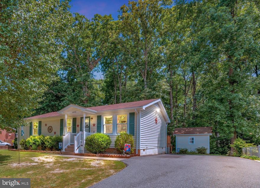 Welcome home!  This one is truly move in ready!!!! One level living offering 3 bedrooms and 2 full baths.  Features include stainless steel appliances, beautiful wood flooring, french doors to deck off kitchen, tile counters in kitchen, crown molding in living room and primary bedroom,  primary bath with  dual vanities, walk in closet, washer/dryer,  large detached shed for all of your toys and lawn equipment.  Plenty of driveway parking.  All of this backing to trees and Loriella Park! Close in location convenient to shopping, dining, medical facilities! HURRY!