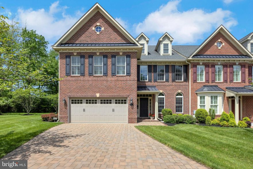 Elegant Townhome in Premier 55+ Community with Wooded Views & Elevator Access. Nestled in the sought-after Delancey Court 55+ community, just minutes from the heart of historic Newtown Borough, this meticulously appointed townhome offers the perfect blend of privacy, luxury, and low-maintenance living. Perfectly positioned within the neighborhood on a premium lot backing to serene woods, this residence welcomes you with a paver driveway, covered portico, and manicured landscaping that hints at the elegance within. Step inside to discover a bright and open floor plan, enriched by abundant natural light, hardwood flooring throughout the main level, and high-end designer touches. A grand open staircase and a spacious private elevator ensure easy accessibility to all three levels of the home. At the heart of the main floor is a stunning gourmet kitchen with rich cherry cabinetry, a peninsula for added prep space, granite countertops, a decorative tile backsplash, and premium stainless-steel appliances including a gas cooktop with hood. The kitchen flows seamlessly into a sunny breakfast area and expansive great room, where soaring two-story windows frame tranquil wooded views and a cozy fireplace anchors the living space. Step outside to a private composite deck, perfect for relaxing or entertaining amidst lush landscaping and peaceful surroundings. Upstairs, the primary suite is a luxurious retreat featuring dual walk-in closets with custom organizers and a spa-like bath complete with a soaking tub, oversized shower, dual vanity, and separate water closet. Two additional bedrooms and a hall bath — one with direct access — offer ample space for guests. A versatile loft overlooks both the family and living rooms, while a finished third-floor bonus room provides endless flexibility for an office, den, or extra guest suite. Additional highlights include a stylish powder room, oversized 2-car garage, full security system, and extensive upgrades throughout. Residents of Delancey Court enjoy access to a spectacular 5,076 sq. ft. clubhouse featuring an indoor pool, state-of-the-art fitness center, billiards and card rooms, library, social lounge, and outdoor pool with a covered patio, garden area, grilling station, and bocce court. Conveniently located near shopping, dining, Tyler State Park, Washington Crossing, and major routes for easy access to Philadelphia, Princeton, and New York City, this exceptional home is the epitome of luxury and lifestyle in a vibrant 55+ community.