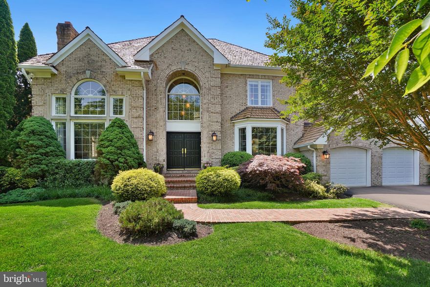 The lushly landscaped front exterior of this all-brick, custom, 7 bedroom, 4.5 bath colonial opens to a dramatic marble foyer. The elegant living room with its Palladian windows, soaring ceilings and travertine marble fireplace is complemented by the airy, light-filled office and the gracious dining room. The large, updated table-space kitchen featuring a Sub-Zero refrigerator, stainless steel appliances and quartz counters overlooks the magnificent family room. Both open to the huge Trex deck. A beautiful powder room, laundry room, mudroom and 2-car garage complete this floor. Upstairs finds a fantasy primary bedroom suite showcasing a huge walk-in closet and a renovated bath. The adjoining room is perfect for a nursery, private office/hideaway or another bedroom. This room shares a Jack-and-Jill bath with the guest bedroom. Two additional bedrooms share a renovated Jack-and-Jill bath. The bright walk-out lower level includes a large recreation room, home theater, gym, 2 additional bedrooms and a full bath. Hardwood floors, recessed lights, and decorator window treatments and light fixtures are just some of the quality custom details found in this special home. Perfectly sited on 1/3-acre pool-ready cul-de-sac lot, schools and shopping are just minutes away. Easy access to major transportation routes makes commuting a breeze.