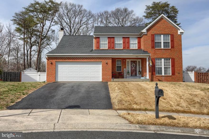 Beautiful move-in ready 4-bedroom, 3.5-bath home tucked away on a quiet cul-de-sac, offering comfort, space, and great indoor–outdoor living. The main level features hardwood floors, abundant natural light, a welcoming living room, separate dining room, and a spacious family room with a cozy wood-burning fireplace just off the kitchen.  The beautifully updated kitchen includes a pantry and opens through French doors to a spacious deck, overlooking a large fenced backyard with an above-ground pool—perfect for relaxing or entertaining. A convenient first-floor laundry room and 2-car garage add everyday functionality.  Upstairs, the generous primary suite features a walk-in closet and a private upgraded en-suite bath with a designer soaking tub. Three additional bedrooms and a full hall bath complete the upper level.  The spacious finished basement provides even more living space with a recreation room, an additional full bathroom, and a versatile bonus room ideal for a home office, library, exercise space, or storage.  This home offers the perfect blend of space, comfort, and entertaining potential both inside and out.