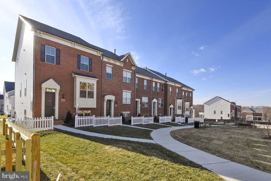 Upgrades throughout entire home! This END unit town home boasts a white kitchen with white marble backsplash, Black Galaxy Granite and Coffeebean hardwood, stainless steel appliances.Basement has FULL bathroom and rec room for future conversion to a 4th bedroom! Upstairs, 3 full bedrooms and upgraded tile in 2 bathrooms. LAST end unit facing park space!