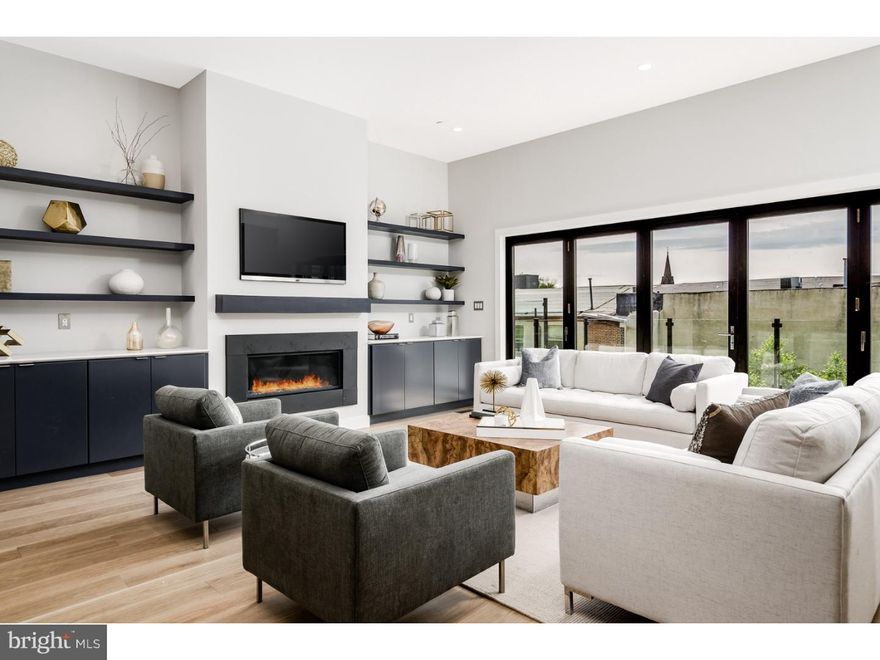 Welcome to Silver Hill -- A very special collection of 7 high-end ultra luxurious contemporary townhouses in the heart of Manayunk only to be found in the city -- Until now. These 4 BR/3.5 BA ultimate city homes with elevator have been thoughtfully designed by Canno Architecture for today's urban living. Entire facade is a very dramatic custom window wall. Enter into a 20+ foot wide living floor with soaring 11 foot ceilings. Open-concept dining room, fabulous chef's eat-in kitchen with sleek Thermador appliance package. Large living room with linear gas fireplace and custom built-in shelving and built-in cabinetry. Entire back wall of La Cantina Accordion style glass doors opens out to step-out deck with contemporary glass railings truly brings the outside in. Ascend to the second floor to the most fabulous master-suite oasis with 10 foot ceilings. Large Master BR with glass doors opening out to yet another step-out balcony also with contemporary glass railings. Western views with the most incredible sunsets. Runway style hallway features dual closets with custom built-in systems leads to a huge spa-like master bathroom complete with 2 vanities and 2 water closets on opposite ends of the bathroom. Over sized step-in shower with frame less glass doors and luxurious soaking tub. European bathroom finishes throughout furnished by Porcelanosa. Third floor features 2 guest bedrooms, large laundry room with custom cabinetry and counter tops plus a third guest suite with en-suite full bathroom which could also make a gorgeous home office. Ascend to the pilot house with large wet bar bar including beverage center for entertaining. Two-sided rooftop deck - Entertaining side includes optional hot tub and spectacular views. Opposite side features a Rooflite soil green roof system with self-feed soil. 2-car attached rear garage plus bonus room which could be a great office/gym/playroom/mud room plus over sized coat closet. Many green features including tank less hot water heater, icynene spray foam insulation, green roof plus high efficiency dual Carrier HVAC system. 5-stop elevator. Easy access to Center City, transportation, highways and the suburbs. 10-year property tax abatement. Truly exceptional masterpieces with no expense spared for the most discerning buyer.