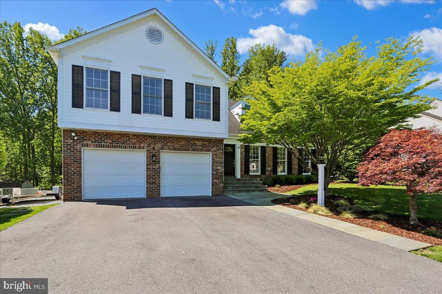 Tucked away on a quiet cul-de-sac surrounded by mature trees and thoughtfully curated landscaping, this beautifully updated home blends timeless charm with elevated modern comfort. From the moment you arrive, you’ll appreciate the impressive curb appeal featuring updated front landscaping, a welcoming walkway and steps, expanded driveway, and additional gravel parking pad, all contributing to the home’s warm and polished presence.

Inside, sun-filled living spaces and a flowing layout create an atmosphere that feels both elegant and comfortable. Warm hardwood floors, spacious gathering areas, and thoughtful design touches throughout make the home equally suited for everyday living and entertaining. The beautifully remodeled kitchen serves as the heart of the home, offering rich cabinetry, granite countertops, stainless steel appliances, expansive island seating, and a cozy breakfast area overlooking the peaceful backyard. Nearby, the family room is anchored by a stunning high-end Mendota gas fireplace insert, creating the perfect setting for quiet evenings or gathering with family and friends.

All three bathrooms have been tastefully renovated with premium Porcelanosa Spanish tile and refined finishes throughout. The luxurious primary bath feels like a private retreat, showcasing a freestanding soaking tub, oversized glass shower, and spa-inspired details that bring a sense of relaxation and sophistication to everyday life.

Outdoor living is equally impressive. The expansive rear deck and beautifully appointed gazebo create an ideal extension of the home — perfect for summer dinners, morning coffee, or simply unwinding while enjoying the private tree-lined backyard setting. Every improvement has been made with care, creating a home that feels effortlessly maintained, thoughtfully upgraded, and truly special.

Additional items conveying with the sale include three deck sofas and coffee table, garage safe, garage refrigerator, and a Weber grill (Hooked up to the natural gas line). TVs convey with the exception of the basement television. A rare opportunity to own a meticulously maintained home offering timeless style, meaningful updates, and a setting that feels both peaceful and inviting