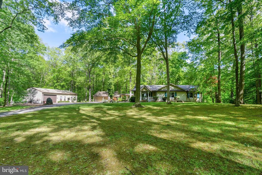 The holidays are over, and we are active and ready for you to see this gem! Welcome to the country!  You must see this lovely 3 bedroom, 2.5 bath custom built home with beautiful mature landscaping perfectly situated on 3.34-acres.   A cozy screened in back porch and an open front porch to relax and enjoy nature. This home is truly warm, welcoming and well maintained.   The main bedroom was enlarged with an expansive walk-in closet and large bath (shower and spa tub) You will find additional space in the partially finished basement with heat/air.  Newer HVAC 3.5 ton. There are two additional outbuildings. One is a two-car detached garage with a breezeway to the house.  The larger one is a fabulous 30 x 60 with a workshop, 220v, storage loft, an office and a large gathering/ party room.  Perfect for large family/friend gatherings and/or a small home business.  One of a kind! Just 18 miles each direction to Chestertown, Centreville, Dover and Middletown.  Do not pass this one up!