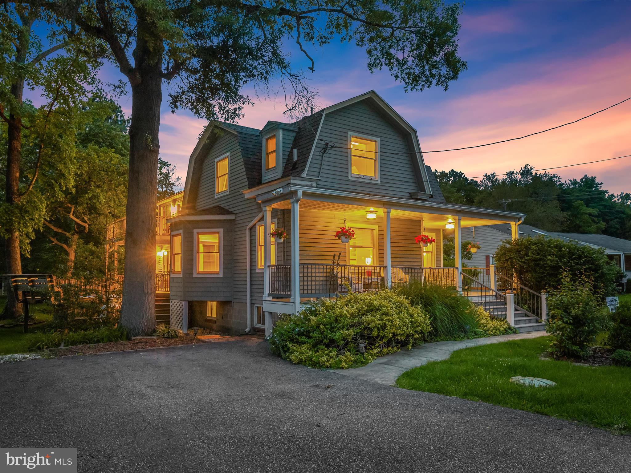 Paradise awaits at this beautifully updated four bedroom, three bathroom waterfront retreat, offering the perfect blend of comfort, elegance, and outdoor living. Set on 1.65 acres with a private pier, it’s both an entertainer’s dream and a peaceful escape. Host unforgettable gatherings in the formal dining room adorned with coffered ceilings and wainscoting, with a stylish wet bar just steps away. The gourmet kitchen is a showstopper, boasting granite countertops, a tile backsplash, 42” cabinets with underlighting, and stainless steel appliances, including a double wall oven and gas cooktop. The open-concept layout flows into a spacious living room with serene views of the surrounding greenery and easy access to the expansive tiered deck and backyard. A main-level bedroom and full bathroom with a frameless glass walk-in shower add flexibility for a variety of needs. Upstairs, the luxurious primary suite feels like a private retreat, featuring a soaring cathedral ceiling, walk-in closet, and a spa-inspired bathroom with a jetted tub and walk-in shower with dual showerheads. A private balcony overlooking the water offers the perfect spot for morning coffee or evening sunsets. Down the hall, two additional bedrooms showcase charming beamed ceilings and provide comfortable, inviting spaces. A full bathroom with a tub-shower serves this level, along with a versatile den ideal as a reading nook, home office, playroom, or lounge area. The expansive unfinished basement provides laundry, abundant storage, and room to grow. Outside, enjoy the tranquil setting with beautifully landscaped grounds, a fire pit, and ample space to entertain, relax, and savor life by the water. You will love this prime location in Bowleys Quarters, where relaxed waterfront living meets direct access to Middle River—perfect for boating, fishing, and outdoor fun. This coastal community offers local marinas, popular waterfront dining, and stunning views, all just 30–40 minutes from downtown Baltimore. Recent improvements include refinished hardwood floors (2025), new deck boards (2024), oil tank (2024), remote sink drain pump system (2023), and two new furnaces (2022). Some images have been virtually staged.