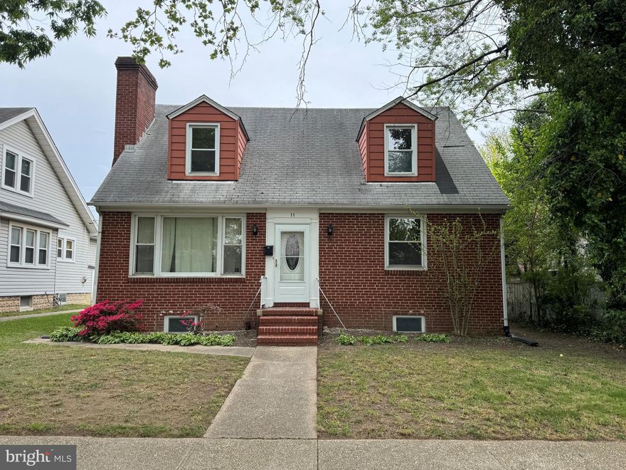 Welcome to 11 Liberty Parkway where the possibilities are endless. This classic detached home is close to shopping, I-95 and 695.  Walk into the main level living room with a cozy wood stove. Kitchen has space for a dining room table. 2 generous sized bedrooms and a half bathroom on the main level.  Broad stairs leading to the upper level. 2 spacious bedrooms with higher ceilings in this cape code.  1 full bathroom. Gorgeous Hard Wood Floors on the main  and upper level. Basement is partially finished including a flush and could possibly be used as an in law/au pair suite. Spacious porch off of the back main level. Parking in the back of the house and on the street as well. Some updates have been done including a new oil water boiler for heat  and now this one needs your finishing touches to make it your own.
