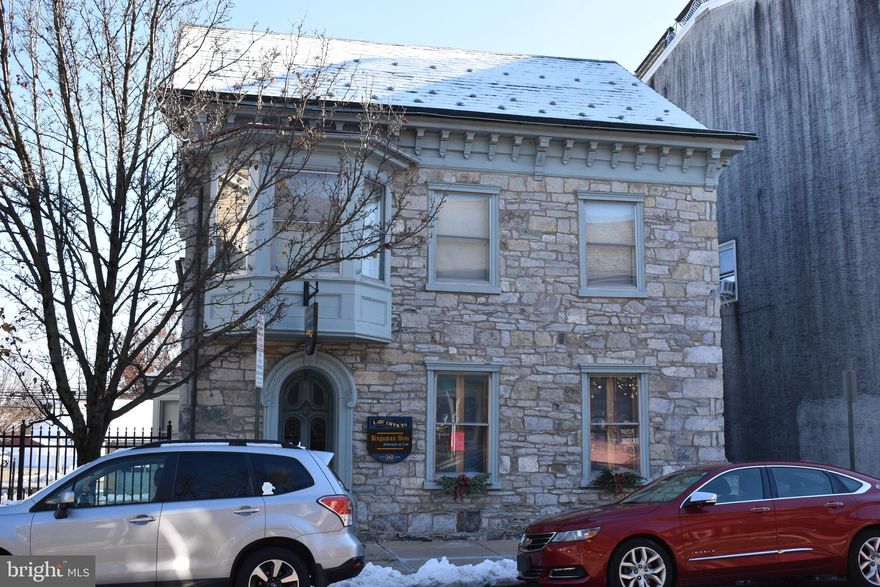 Formerly known in the 1800's as "The Physicians House" this REMARKABLE DISPLAY OF ARCHITECTURE is available for your investment portfolio.   This mixed use building is located in the Central Business District in Kutztown. The zoning allows a multitude of uses. This historical stone building with its handcrafted original woodwork boasts success as soon as you see it from the street and when you enter it.  
The first floor has approximately 1800 square feet. It  is ideal   for professional services such as  law offices, dental, medical, counseling, accounting, architect , financial planning or insurance  offices etc.  It can also be a wonderful retail space.
The second floor has a large apartment that is currently licensed for 2 students.  There are 2 gas heating systems.  Each tenant pays their own heat, electric, trash, water and sewer.
This property is rare because it has a PRIVATE PARKING LOT FOR 9 CARS !!!  Additional parking for your customers  are available on the ADJACENT  MUNICIPAL PARKING LOT WITH 51 SPACES !!!

If you are looking for an investment where you can operate your business on the first floor and have tenants on the second floor pay a chunk of your mortgage you must  take a tour of this property .