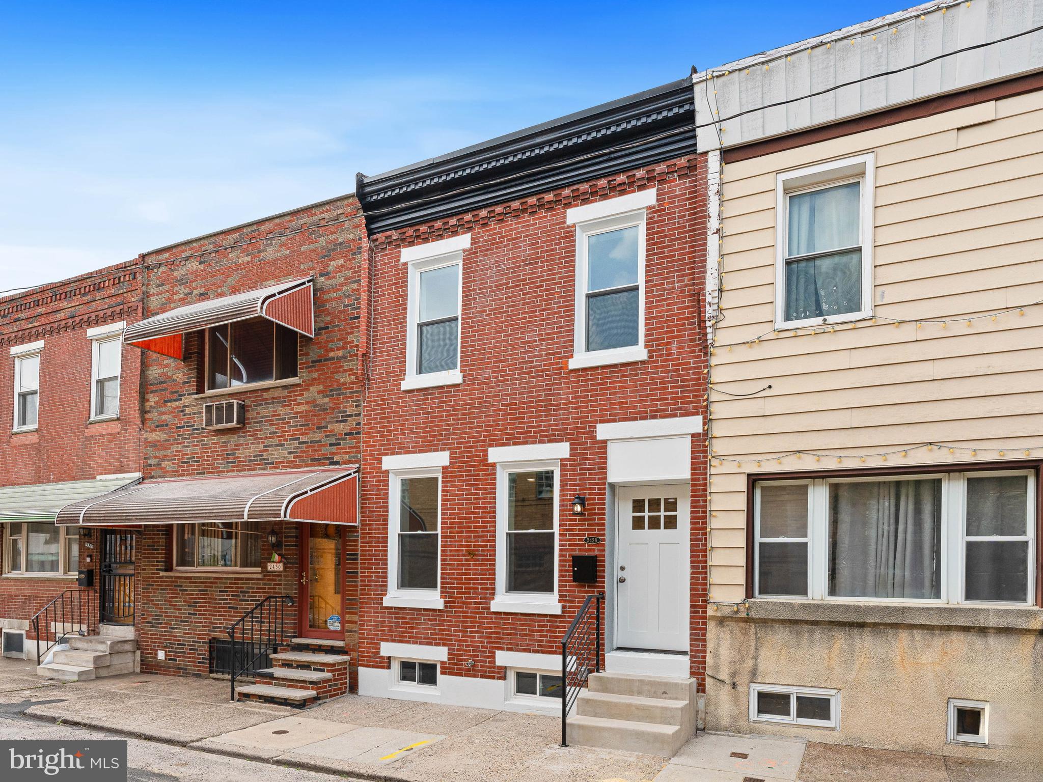 This home has been completely renovated with attention to detail! Enter the beautiful revitalized brick façade to the open Living and Dining rooms concept with wide plank LPV flooring and recess lighting for a chic and ultra modern feel. The Kitchen has a functional layout with hand picked finishes including stainless steel appliances, quartz counter top and upgraded tile backsplash and leads to a spacious, newly cemented rear yard. The 2nd floor has 2 Bedrooms, both with large closets and a fully tiled hallway Bathroom. The Basement is super clean with a rear utility/ laundry room. Convert the front half into your home office or gym. You wont want to miss this one! Located in the LoMo section of South Philly just a few minute walk in either direction to East Passyunk...the restaurants, the shopping & nightlife or all major Sports Venues with Xfinity Live and Live Casino. A quick commute via public transportation, bike or even walk to Center City or the Navy Base. As well, close by major highway and bridge access.