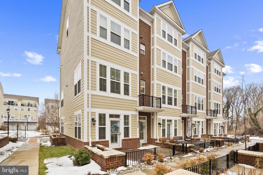 Nestled in the charming Annapolis Townes at Neal Farm, this exquisite end-of-row townhouse offers a perfect blend of luxury and comfort. Built in 2020, the home boasts a timeless Colonial architectural style, featuring a stunning brick and vinyl exterior that exudes elegance. Step inside to discover an inviting open floor plan adorned with crown moldings and rich hardwood flooring. The gourmet kitchen is a chef's dream, equipped with stainless steel appliances, upgraded countertops, and a spacious island, perfect for entertaining. Enjoy cozy evenings by the gas fireplace in the living area, or unwind in the serene primary suite, complete with a walk-in closet and a spa-like bath. Natural light floods through double-pane windows, enhancing the warmth of the home. The upper-level laundry adds convenience to your daily routine, while the outdoor spaces, including a balcony and patio, invite you to relax amidst beautifully landscaped surroundings. With an attached two-car garage and a concrete driveway, parking is a breeze. The community offers delightful amenities such as common grounds and jogging paths, perfect for an active lifestyle. Enjoy tranquil views of lush gardens and trees, creating a peaceful retreat right at your doorstep. This property is not just a home; it's a lifestyle of luxury and comfort, waiting for you to make it your own.