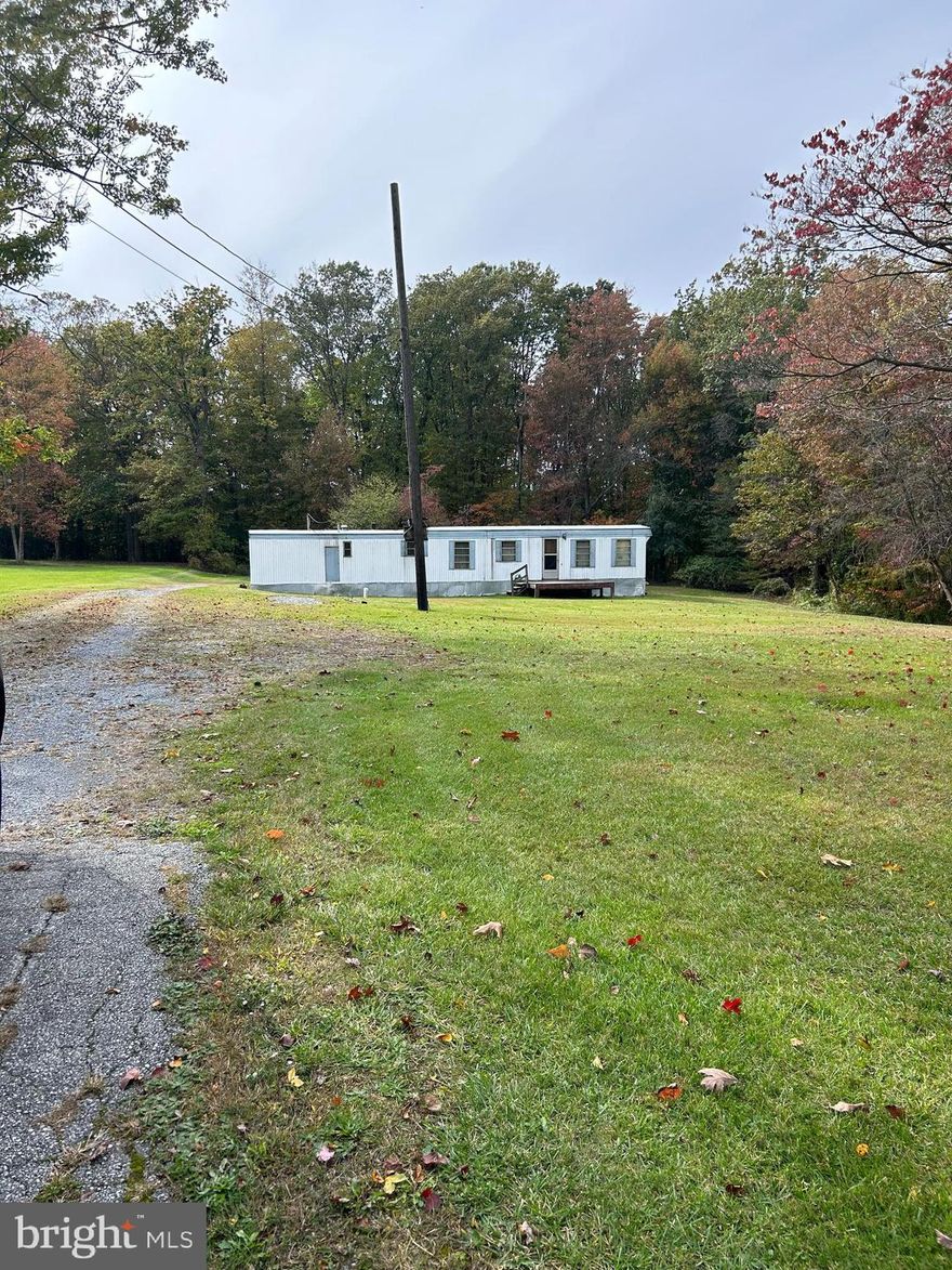 Great acre+ lot in Coatesville. Uninhabitable mobile home currently sits on lot with well and septic. This land is being sold in as is condition. Buyers should check with West Caln Township for any and all possible uses. Demolition permit required to remove mobile home.