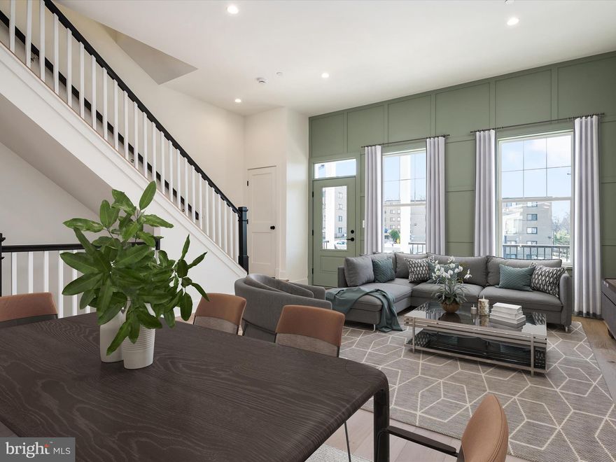 MOVE-IN READY!!! Welcome home to 4018 Gallatin St at Suffrage Point where Werrlein Properties is defying ordinary and defining extraordinary with its new-construction Craftsman Style townhome development.  Suffrage point is a new luxury development community that is located between Hamilton and Gallatin Streets in Hyattsville, and is directly adjacent to the vibrant arts district. You will find that the community delivers a traditional neighborhood ambiance, all within the heart of the already thriving Hyattsville community. These new-construction homes showcase Craftsman style details, coupled with clean, elegant, and modern amenities, all thoughtfully designed to complement the classic residential architecture found throughout the beautiful and historic Hyattsville area. 
This lovely interior unit located at 4018 Gallatin St is move-in ready and complete with engineered wood flooring on all levels and a gourmet kitchen with a spacious kitchen crafted with white quartz and finished with warm and on-trend color accenting.  The eat-in breakfast/dining area is the perfect place to begin and end your day as you look outside into this fabulous community or enjoy your morning coffee on the rear deck.  The upper level provides a spacious side-by-side laundry, and plenty of living space as well.  The 10+ foot ceilings and open floor plan feels incredibly open and creates that high-end luxurious feel.  Every detail has thoughtfully been curated to deliver an exceptional living space, down to the custom trim applications, the custom-built range hood and warm toned and modern accents. The primary bedroom suite includes a generous built-in closet and spacious bathroom, finished with double sinks and a floor-to-ceiling tiled and glass enclosed shower for the spa-like experience everyday. You will also find two more secondary bedrooms and an additional full bath with a fully tiled shower/tub combo.  The lower level is fully finished and provides extra guest/living space with the en-suite bath, and plenty of storage.  To round out the enviable amenities, this beautiful townhome also provides an included smart-home technology package and included EV car charging connection, that ensure you will enjoy living here for many years to come! 
Suffrage Point is conveniently located within walking distance to Shops, Restaurants and the West Hyattsville Metro.  Less than a few miles away on Rte 1 you will also find the Riverdale Park Station offering a Whole Foods Market, a Gold's Gym & many other eateries.  Convenient access to Riverdale Marc Station, the Farmers Market & the buzzing Town Center Market. This modern development also directly borders thirty-two beautiful acres of scenic public parkland with access to playgrounds, a swimming pool & recreation center with restrooms, walking & biking trails that connect to the Northwest Branch Trail, picnic pavilions and a variety of other sports & fitness facilities.