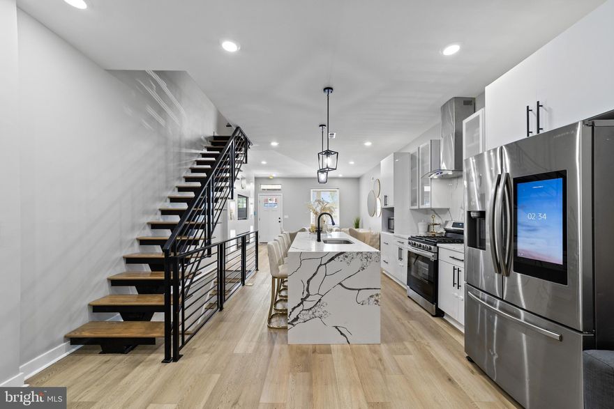 You must see this property and consider this as your next Home!  Welcome to your new home in the Frankford neighborhood, of Lower NE Philly, where contemporary style and modern upgrades come together in perfect harmony. The sleek wrought iron exterior covered porch and entrance railing system sets the tone for the elegance within. Step inside this stunning 2.5 story twin/semi-detached home and discover a captivating living room with a built-in fireplace. The light wood flooring throughout the main level creates an inviting and warm ambiance, complemented by an open floor plan that leads you to a chef's dream kitchen centered around a luxurious granite island. Stainless steel appliances, including a dishwasher, refrigerator, gas range/oven, and a sleek hood, stand ready to support your culinary adventures. Soft-close wooden cabinetry enhances the aesthetic and functionality. Entertain with ease in the dining room, and explore the rear office space – a versatile area perfect for working or relaxing. This space even features a full modern bathroom with a floating sink and a stall shower, ensuring convenience for all. A door from the rear office leads to a fenced rear yard, creating your private outdoor oasis. The fully finished basement offers even more living space, with a bonus room and another modern full bathroom featuring a floating sink and stall shower. This lower level also houses gas utilities and central A/C for your comfort. Ascend the floating staircase to the upper levels, where you'll find three bright and freshly painted bedrooms on the second floor, each adorned with recessed lighting. A laundry closet adds convenience, while a modern hall bathroom with a floating sink and a glass-doored, marble-tiled tub/shower combo elevates daily routines. The owner's suite boasts an en-suite modern bathroom with a floating sink and a glass-doored stall shower, adding a touch of luxury to your personal space. For ultimate flexibility, a spacious 4th bedroom awaits on the third level, offering limitless possibilities for use. This contemporary home truly has it all, including a cozy built-in fireplace in the living room.
Don't miss the opportunity to make this property your own, where style, functionality, and comfort merge seamlessly in a prime Frankford location. Your dream home awaits! Please take a minute to view the Video Tour and then schedule your in-person showing, today!
