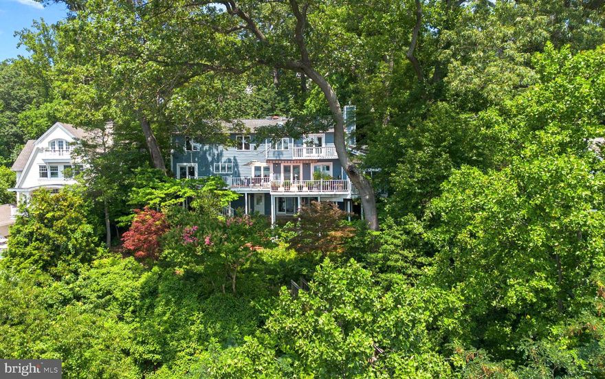 Welcome to this Round Bay gem, where comfort meets coastal charm and sweeping Severn River views greet you at every turn. Enter to a light-filled foyer leading to the open living and dining area, complete with a cozy gas fireplace—perfect for gatherings with family and friends. An adjacent sunken living room offers even more space to relax or entertain. The spacious kitchen is a cook’s dream, featuring generous counter and cabinet space, a kitchen island with cooktop, and plenty of room to gather. Upstairs, the primary suite is a serene retreat, with a private balcony showcasing stunning water views, a skylight that fills the space with natural light, gas fireplace, and a gorgeous en suite bath with a dual sink vanity and glass-enclosed shower. Two additional bedrooms, a full hall bath, and a conveniently located laundry area complete the upper level. The finished walk-out lower level offers endless possibilities—use it as a recreation room, home office, gym, or media space. With a third fireplace, full bathroom and abundant storage, this area as functional as it is flexible. Outside, unwind on the large deck surrounded by the beautifully landscaped low maintenance garden complimented with trees, shrubs, and perennials for added privacy, while you soak in the peaceful views. Enjoy exclusive community amenities including a sandy beach, tennis courts, a playground, a pavilion, and a private boat ramp (with a slip waitlist), as well as kayak and paddleboard storage. Just minutes to Severna Park shopping and dining, the scenic B&A Trail, and top-rated Severna Park Blue Ribbon schools, with easy access to major commuter routes. Don’t miss the opportunity to make this water-view haven your new home. Schedule your private tour today!