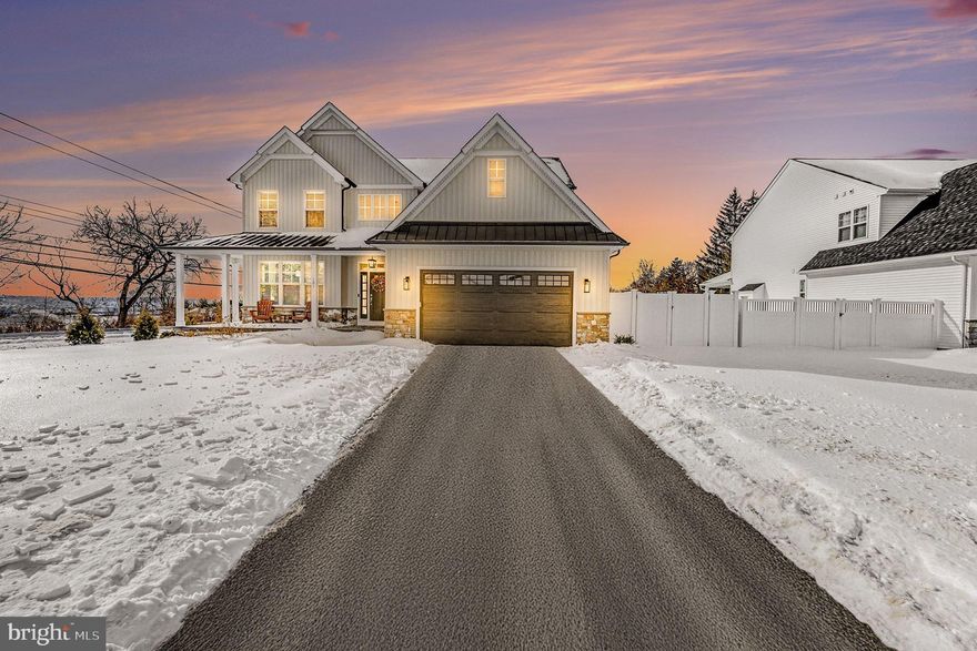 Step into refined elegance in this exceptional 4-bedroom, 2.5-bath single-family residence, where luxury finishes and thoughtful design come together to create a truly elevated living experience. 
From the moment you arrive, the home impresses with a stamped concrete front walk, a charming wrap-around porch, and professional landscaping that enhances the home’s striking curb appeal. 
The fenced yard offers privacy and serenity, while the covered raised stamped concrete patio—complete with a step-down extension—creates an inviting outdoor retreat ideal for entertaining or quiet relaxation. 
 Inside, rich hardwood flooring flows throughout the entire first level and second-floor hallway, complemented by oak-stained stair treads with painted risers for a timeless aesthetic. The heart of the home is anchored by a beautifully appointed living space featuring an upgraded marble fireplace surround and three panel French door that lead seamlessly to the covered patio, blending indoor and outdoor living.  
The gourmet kitchen is a showpiece, showcasing upgraded quartz countertops, premium GE Profile appliances, subway tile backsplash and refined finishes designed for both everyday living and hosting. 
Quartz countertops continue throughout the powder room, laundry room, primary bath, and hall bath, while upgraded porcelain tile enhances all bathrooms, the laundry room, and mudroom. The laundry room 
is thoughtfully designed with upper and lower cabinetry and a stainless steel sink, adding both function and style.  The versatile dining room, enhanced with elegant French doors, offers the flexibility to serve 
as a formal dining space or a private study.  The mudroom is outfitted with built-in storage cubbies and shelving, ensuring organization with a custom feel.  Retreat to the luxurious primary suite, highlighted by 
a tray ceiling and a spa-inspired bath featuring a frameless shower, premium soaking tub, and quartz countertops. Additional high-end conveniences include a whole-home water softener and a reverse osmosis system at the kitchen sink.  Completing this remarkable home is an unfinished basement—an exceptional opportunity for future expansion. Whether you envision a home theater, fitness studio, additional living space, or guest retreat, this blank canvas offers endless potential to tailor the home to your lifestyle. The two car garage includes your very own EV charger! Located in the Colonial School District and offering terrific access to the Blue Route and Turnpike, this home is just a short drive to Whole Foods, the Greater Plymouth Community Center (GPCC), and downtown Conshohocken’s restaurants, shops, and nightlife. With its refined character, airy layout, and luxurious touches, this custom masterpiece offers the lifestyle you’ve been dreaming of—and so much more. An extraordinary place to call home.