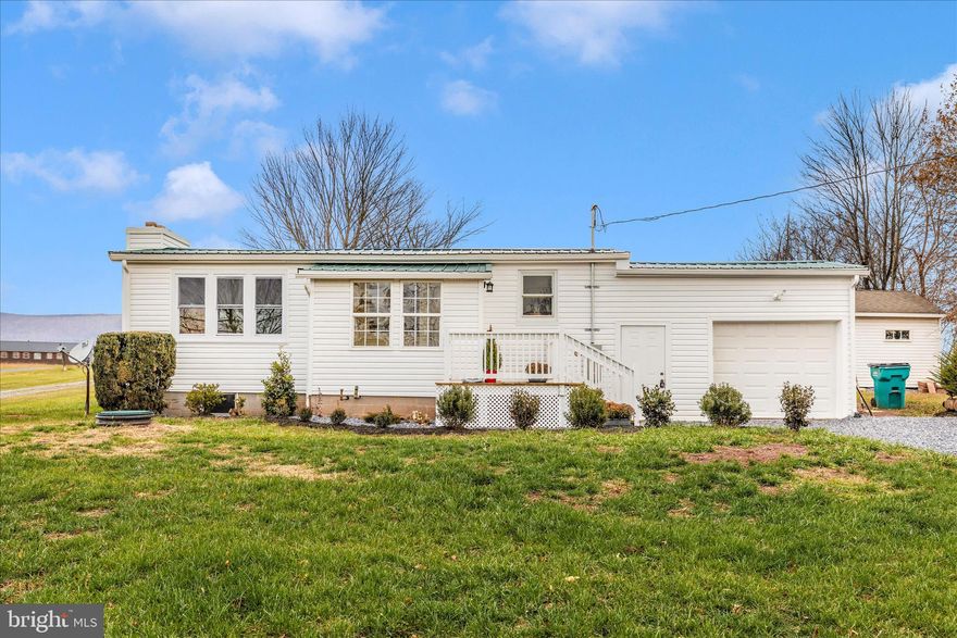 Welcome to this nicely updated home set on a lovely half-acre lot in Thurmont, Maryland. Enjoy beautiful mountain views from your own backyard. Step inside to a light-filled living room featuring abundant windows, a brick fireplace with mantle, and luxury vinyl plank flooring that flows seamlessly through the main living areas, kitchen, and bath. The beautifully updated kitchen shines with white cabinetry, new countertops, and stainless steel appliances, offering a fresh and timeless look. A convenient main-level laundry room is located just off the foyer for added ease. This charming home offers three comfortable bedrooms, all featuring new carpeting, along with an updated full bath showcasing modern finishes. There is also a bonus room that would make a nice sitting room/den, playroom or office. Throughout the home, you'll appreciate the neutral palette and fresh paint, creating a bright and inviting atmosphere. Additional updates include an updated metal roof and a new electric panel and wiring, all adding value and peace of mind. Offering an oversized one car garage coupled with  its thoughtful renovations, modern style, and beautiful views, this Thurmont gem is truly move-in ready and waiting to welcome you home.